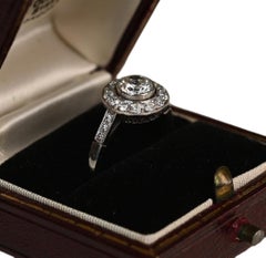 Platinum Diamond Halo Ring. 0.60ct Round Brilliant Diamond Engagement Ring J VS2