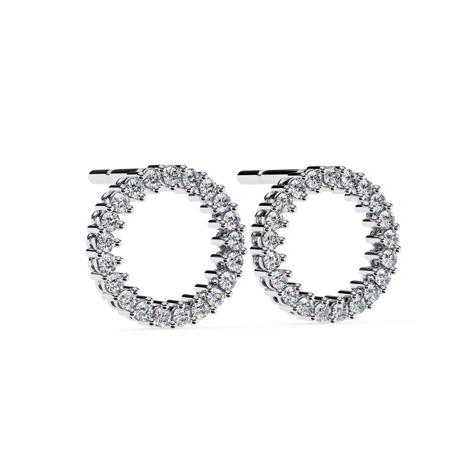 Introducing our Halo Harmony Earrings, a timeless expression of elegance and grace. Crafted in 14kt white gold weighing 2.44 grams, these exquisite earrings showcase 0.38 Ct of round, natural diamonds in a radiant circle design. Each diamond is IGI