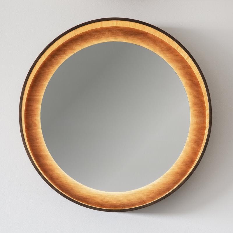 Round backlit wall mirror with LED light in walnut.
This Halo mirror collection is available in two sizes and 3 wood finishes (Ash, Oak and Walnut) and in any color finishes. 

Dimension:
Ø 26” & Ø 34” / Ø 66cm & Ø 86cm 

Materials:
veneer in