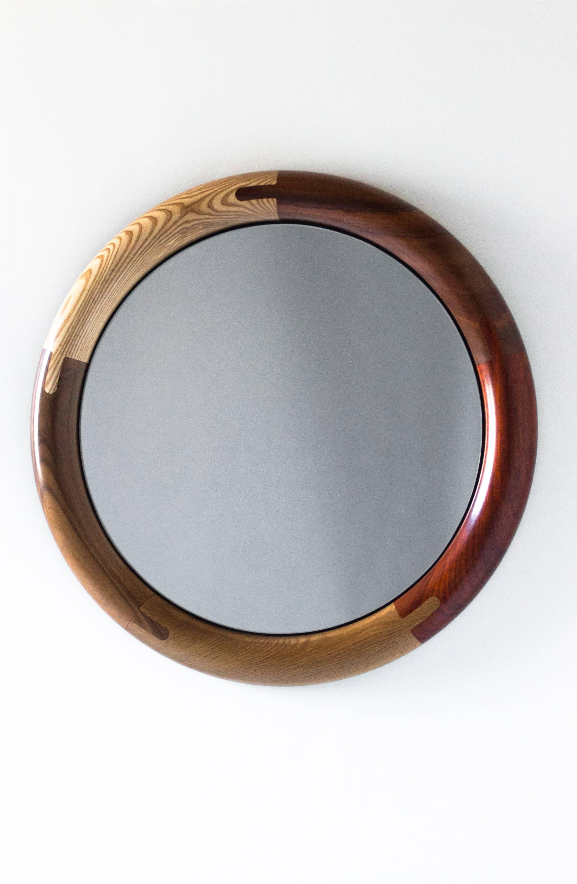 Composed of a richly colored range of wood species and featuring detailed joinery and simple, legible construction, the Halo Round Mirror makes you look good just for owning it.