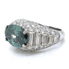 HALO RING 7.09 Ct GIA Fancy Deep Grayish Green Diamond and 7.70 Ct in 18K