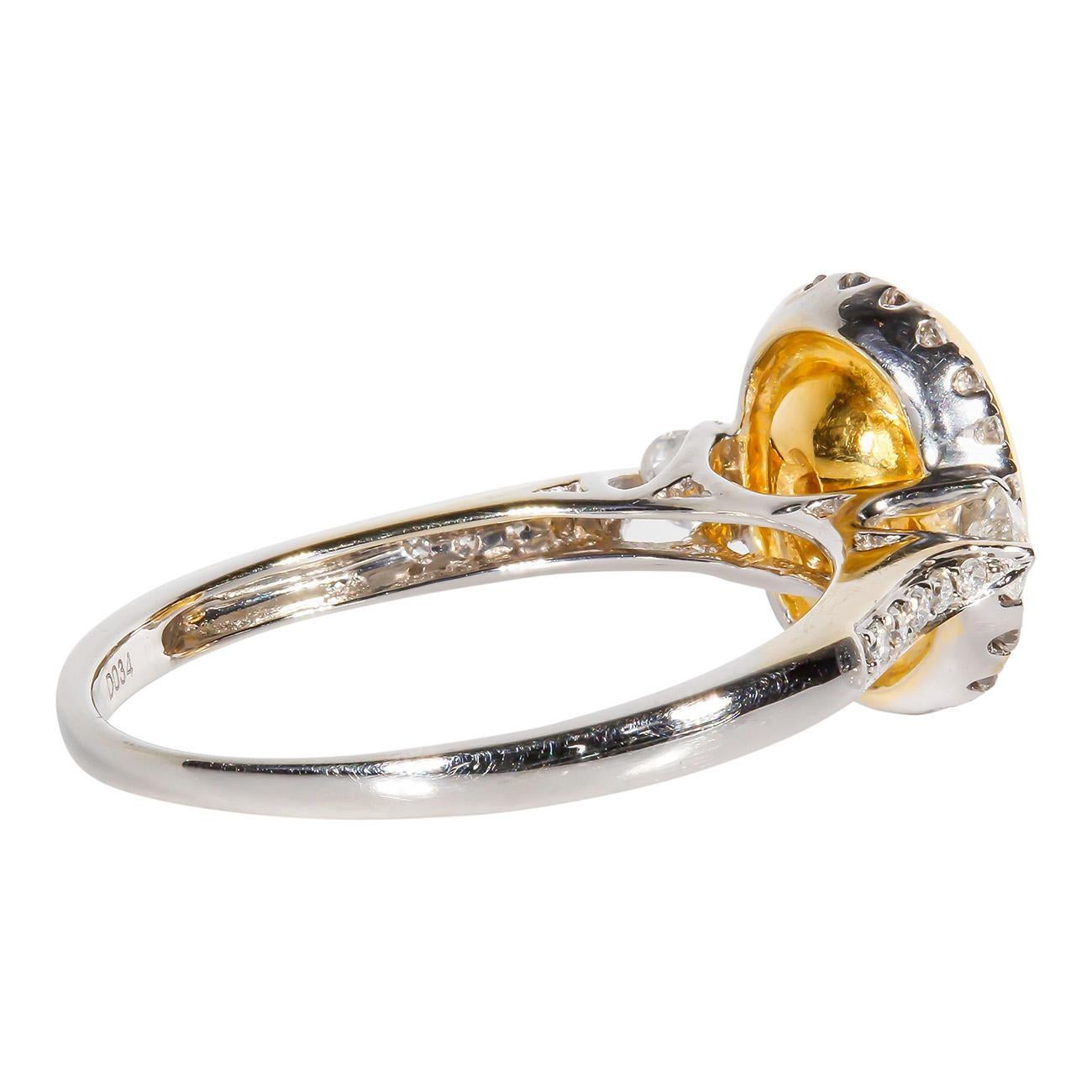 Oval Cut Halo Ring in 18K WG with Fancy Light Yellow Oval Diamond Center. D1.36ct.t.w. For Sale
