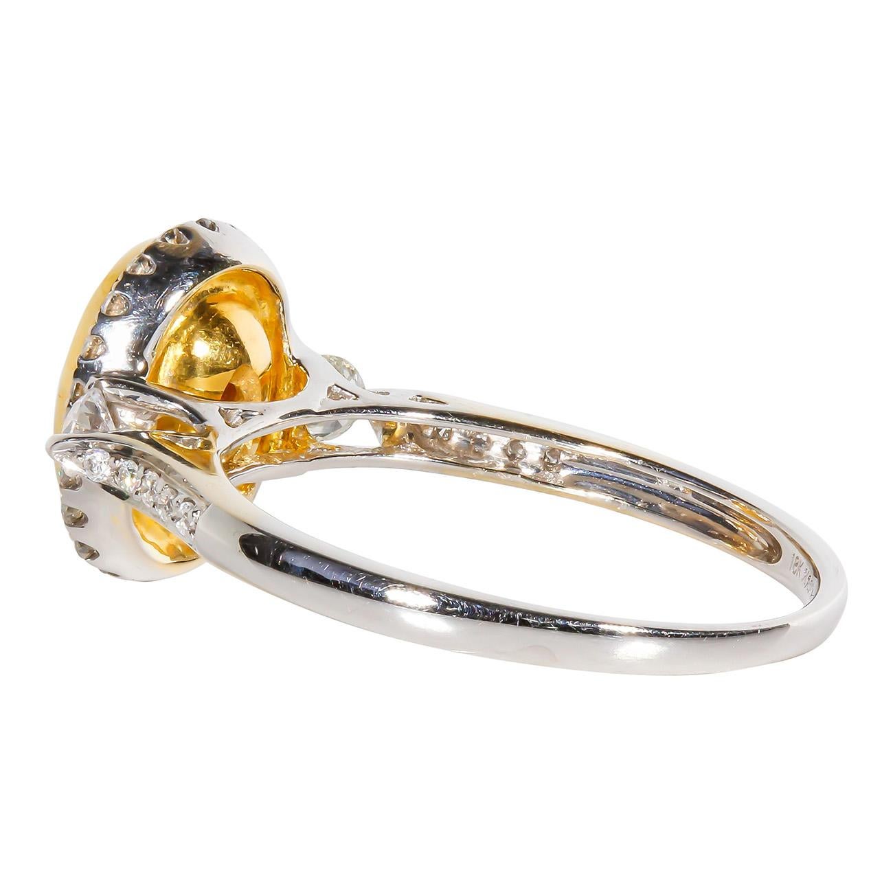 Women's Halo Ring in 18K WG with Fancy Light Yellow Oval Diamond Center. D1.36ct.t.w. For Sale