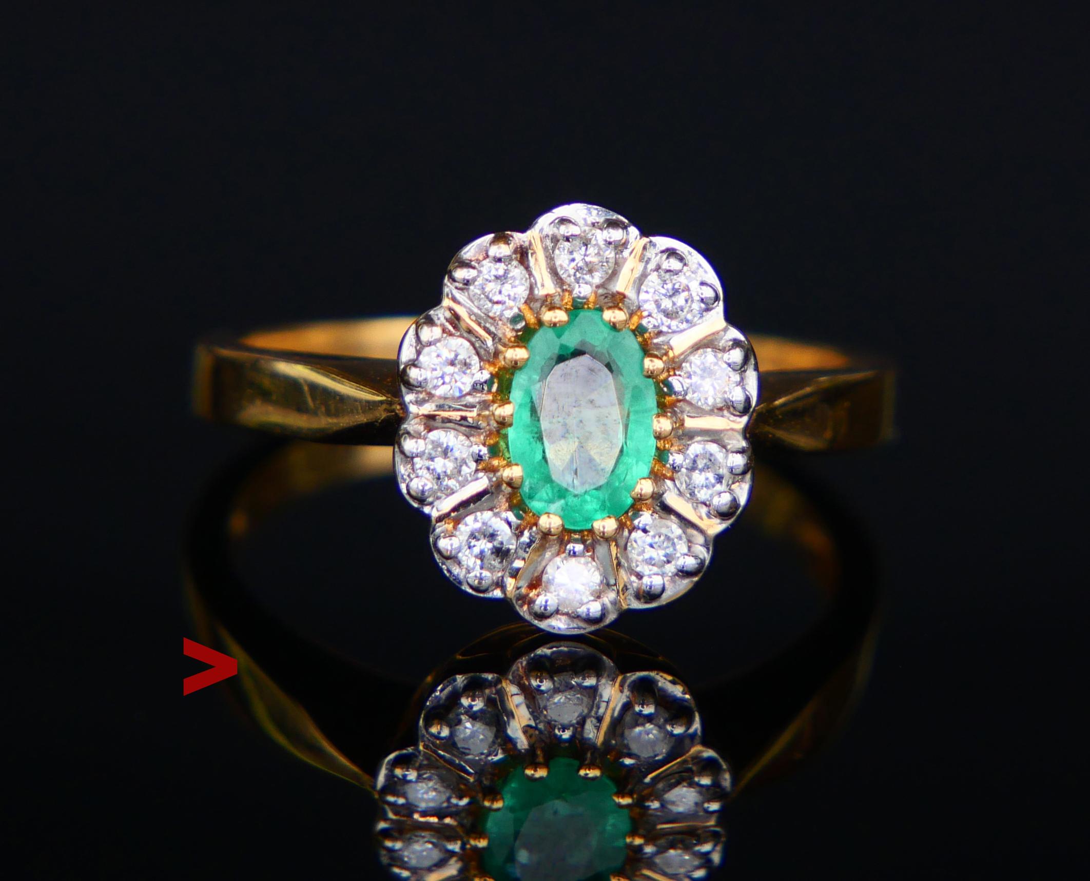 Vintage 1950's Halo Ring featuring natural oval diamond cut Emerald 7 mm x 4.5 mm x 2.75 mm ca. 0.85 ct with natural internal flaws and inclusions.

Emerald is accented with ten equally sized diamond cut cut Diamonds Ø2 mm / 0.02 ct each, total