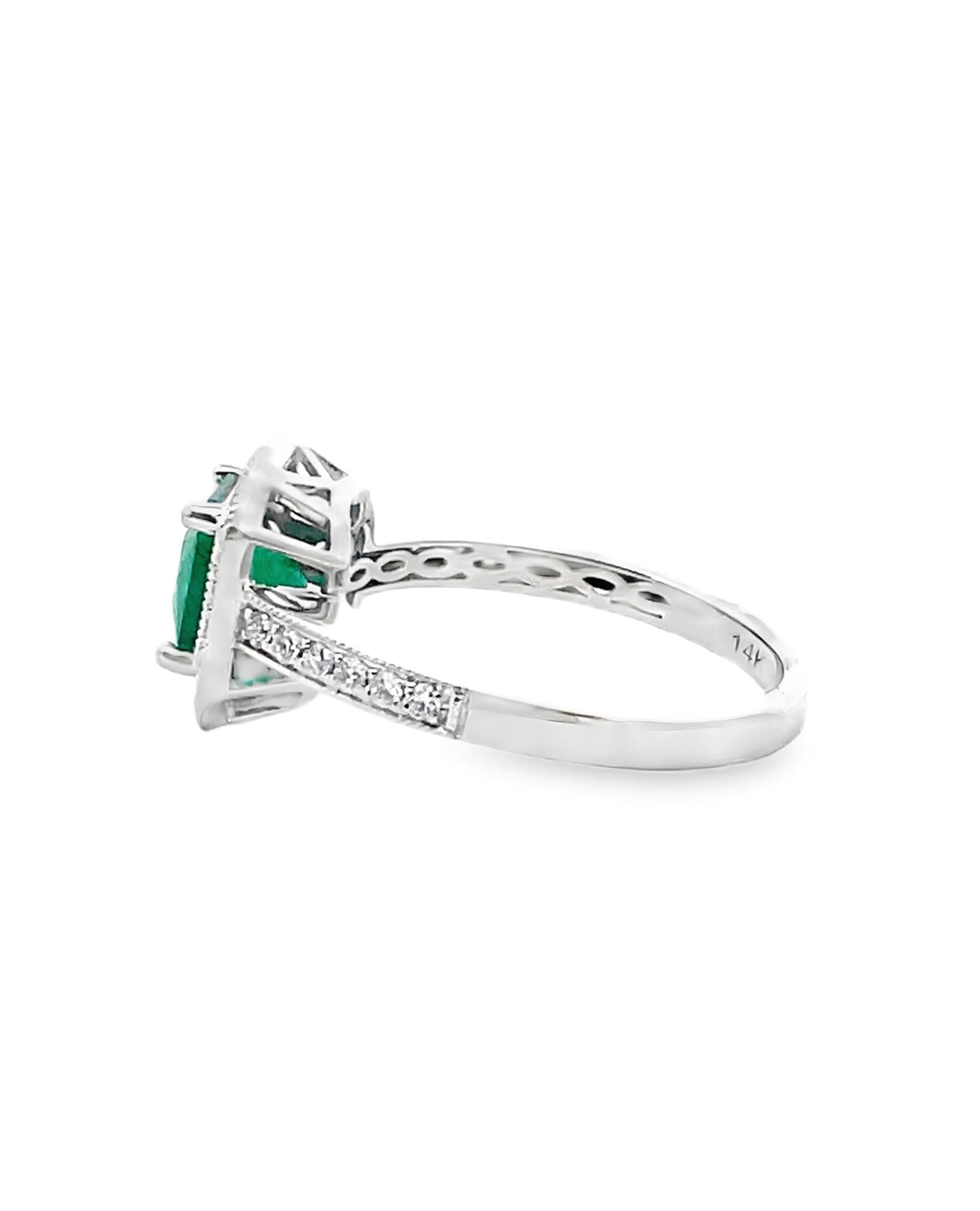14K white gold with round brilliant cut diamonds weighing 0.36 carat total. One center modified cushion cut emerald weighing 1.19 carats. 

- Finger size 7, can be sized up or down by up to two sizes
- Diamonds are GH Color / SI Clarity