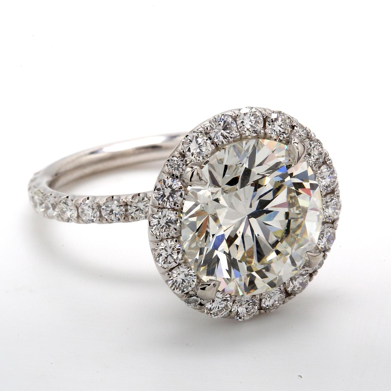 Round Cut Halo Ring w/ GIA Certified J/SI1 7.01ct. Round Diamond Center.  D8.79ct.t.w. For Sale