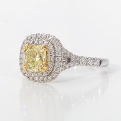 Halo Ring with Fancy Yellow Cushion Cut Diamond Center.  D1.49ct.t.w.