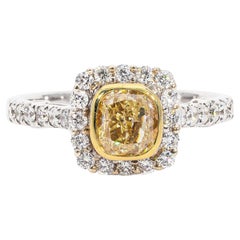 Halo Ring with Fancy Yellow Cushion Cut Diamond Center. D1.50ct.t.w.