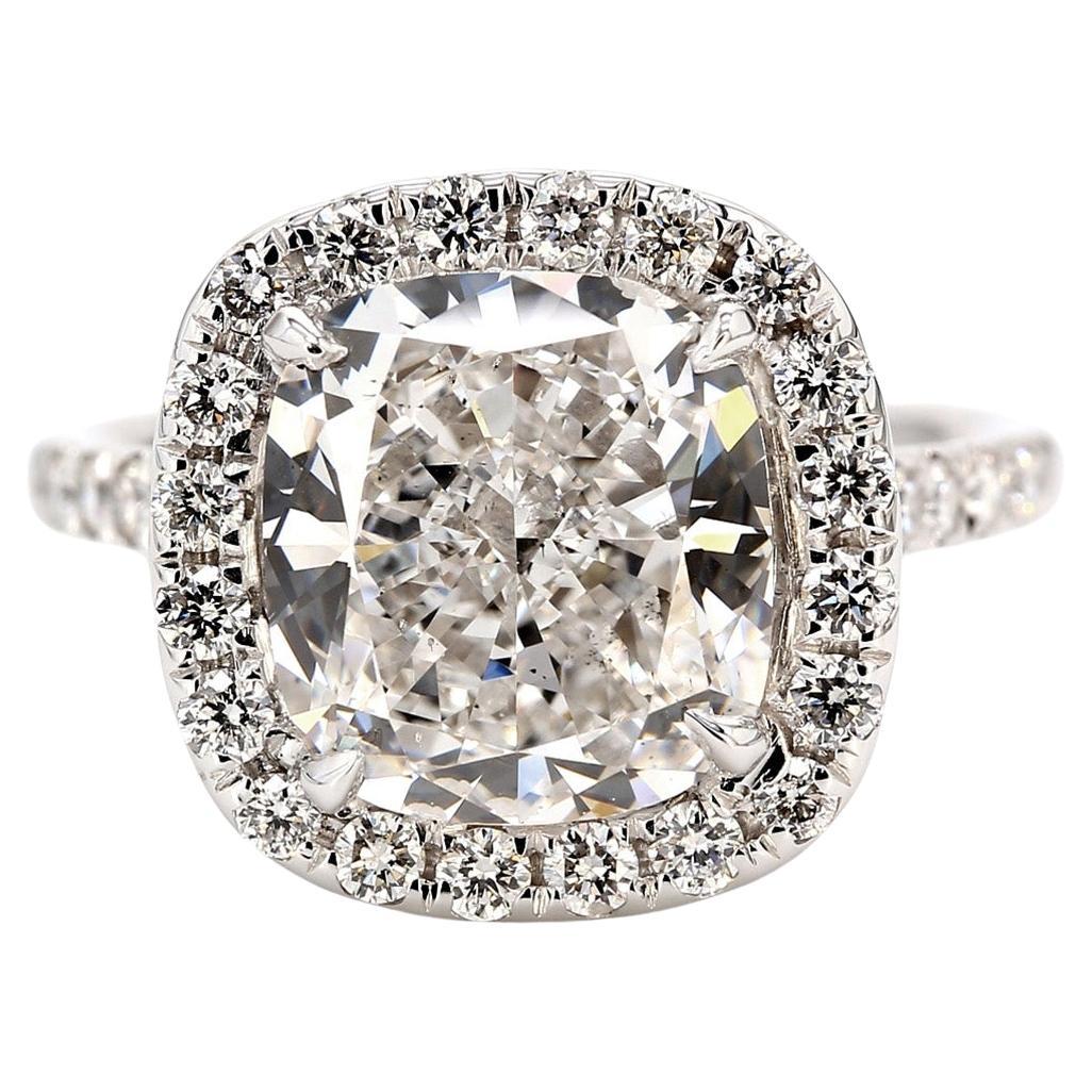 Halo Ring with GIA certified E/SI1 Cushion Cut Diamond Center. D5.77ct.t.w. For Sale