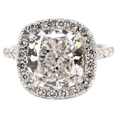 Halo Ring with GIA certified E/SI1 Cushion Cut Diamond Center. D5.77ct.t.w.