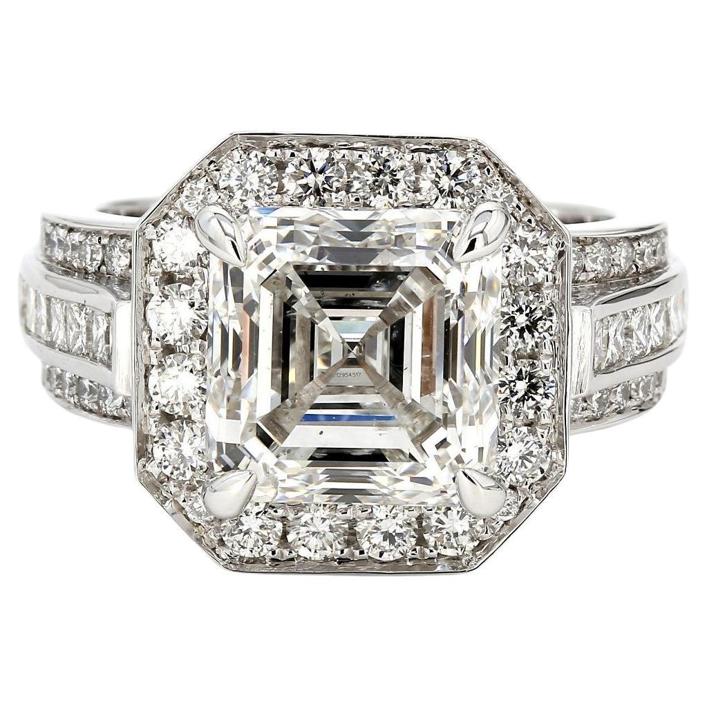 Halo Ring with GIA certified H/SI2 Asscher Cut Diamond Centerstone. D6.51ct.t.w. For Sale