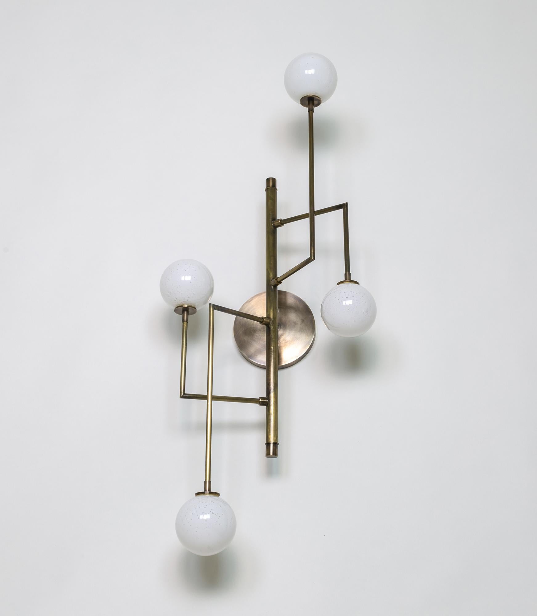 Kalin Asenov designs and fabricates lighting in Savannah, GA. Asenov works with a team of artisans and manufacturers to prototype, and build all pieces in his studio.

The design of Halo interprets ideas of celestial secret geometry; the form