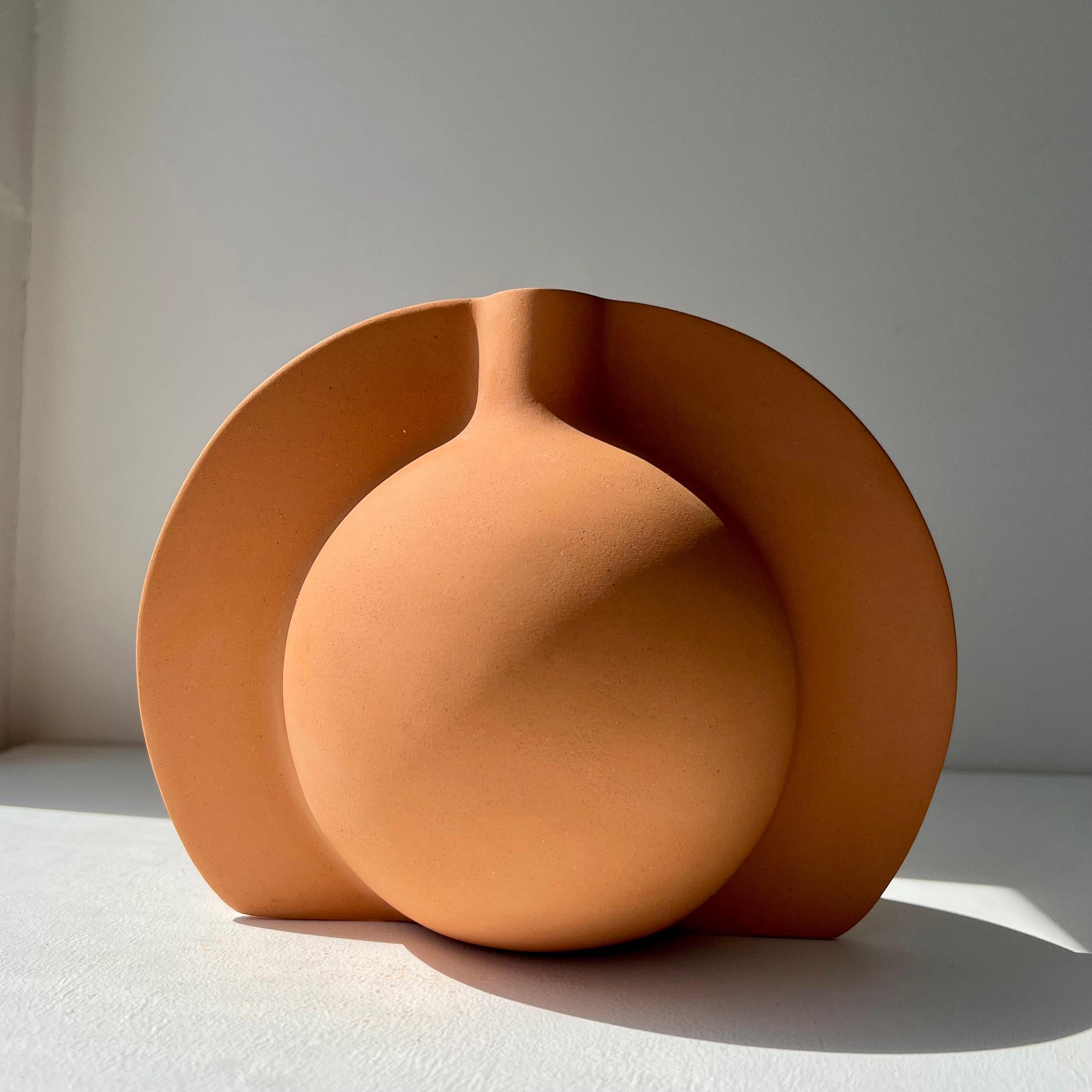 Halo Sculptural Vessel by Karin Amdal
One Of A Kind.
Dimensions: D 19.5 x W 12.5 x H 16 cm.
Materials: Ceramic/stoneware clay.

Pieces are hand-made, one of a kind, and sizes may vary slightly. Can be made to order in grey/brown/black/white