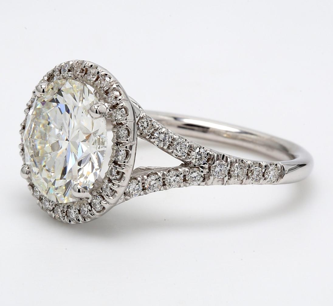 Round Cut Halo Split Shank Ring with F/SI2 GIA Round Diamond Center. D4.60ct.t.w. For Sale