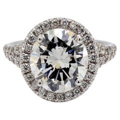 Halo Split Shank Ring with F/SI2 GIA Round Diamond Center. D4.60ct.t.w.