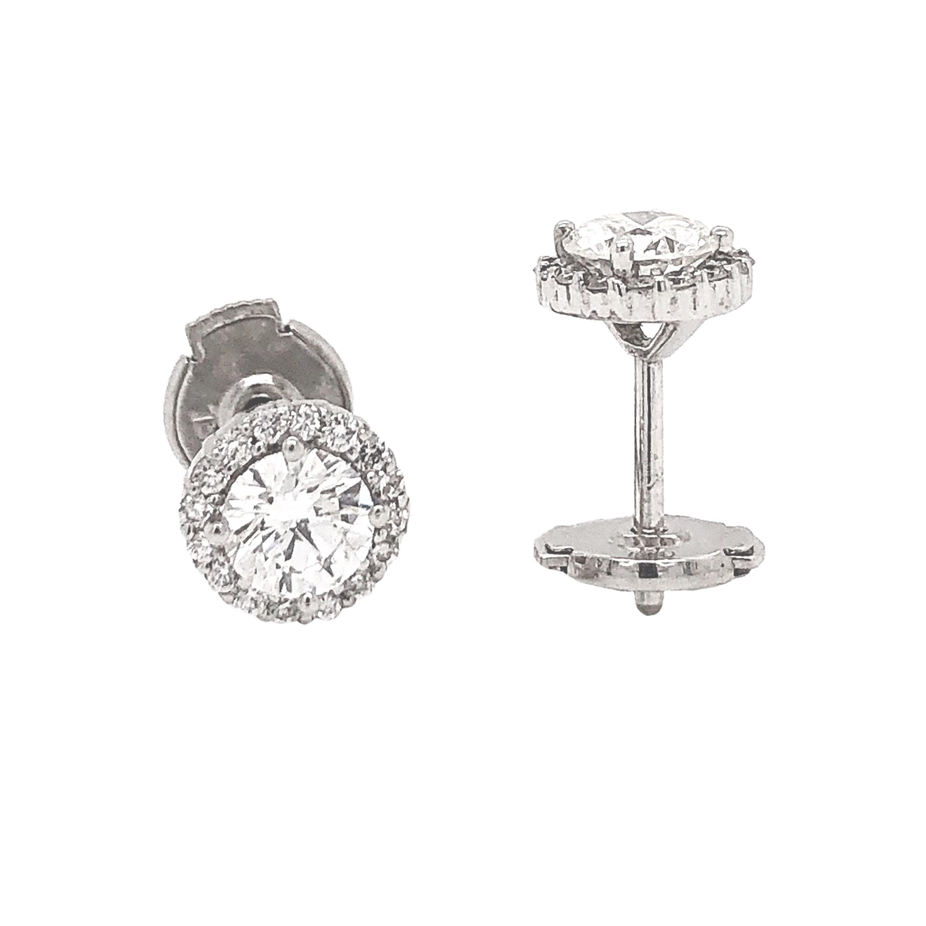 Halo Stud Round Brilliant Cut Diamond Earrings 0.85 cts t.w. 18K White Gold

18K White Gold Diamond stud Earrings 2 large Center Stones in the middle of the earring 2 = 0.67ct t.w. Brilliant-

Additional Information:
cut round G in color SI 1 in