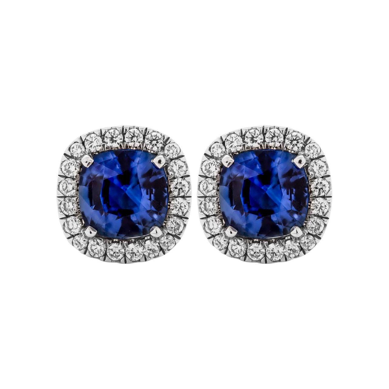 Classic design that is essential addition to any jewelry collection, a true staple! 
Nice and delicate halo around center stone diamonds make stones appear larger, looks like a true 1 carat. 
Each Sapphire 1.06ct 
Total Carat Weight pave: