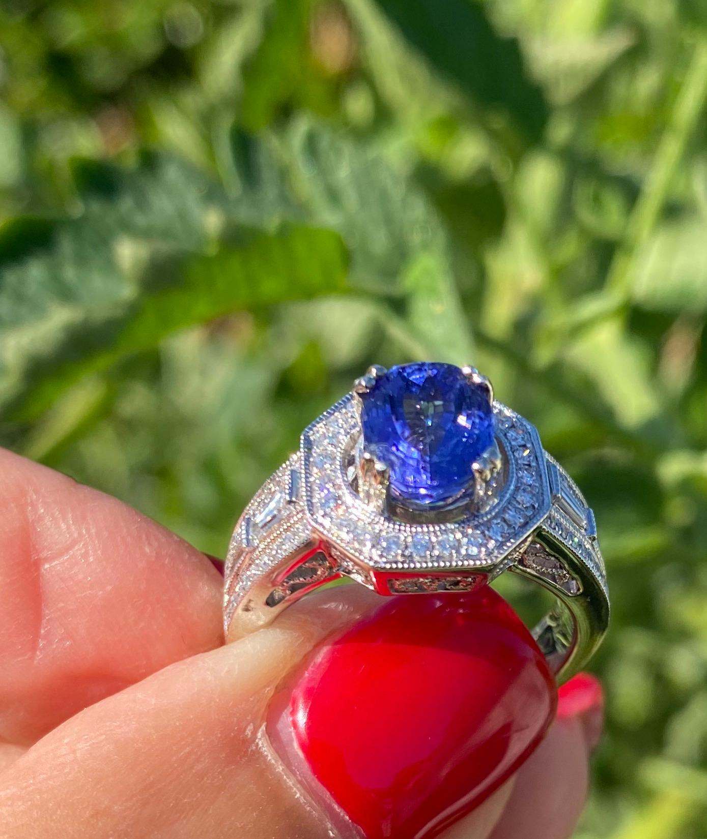 Halo Tanzanite and Diamond Ring, 2.70 Carat VS Quality 18 Karat In Excellent Condition For Sale In Laguna Hills, CA