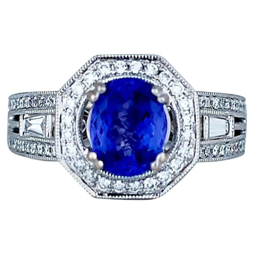 Halo Tanzanite and Diamond Ring, 2.70 Carat VS Quality 18 Karat For Sale