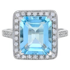Halona Verlobungsring im Art-déco-Stil mit blauem Topas im Smaragdschliff und Diamanten