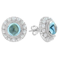 Cabochon Blue Topaz and Pearl Halo Stud Earrings in 14K White Gold