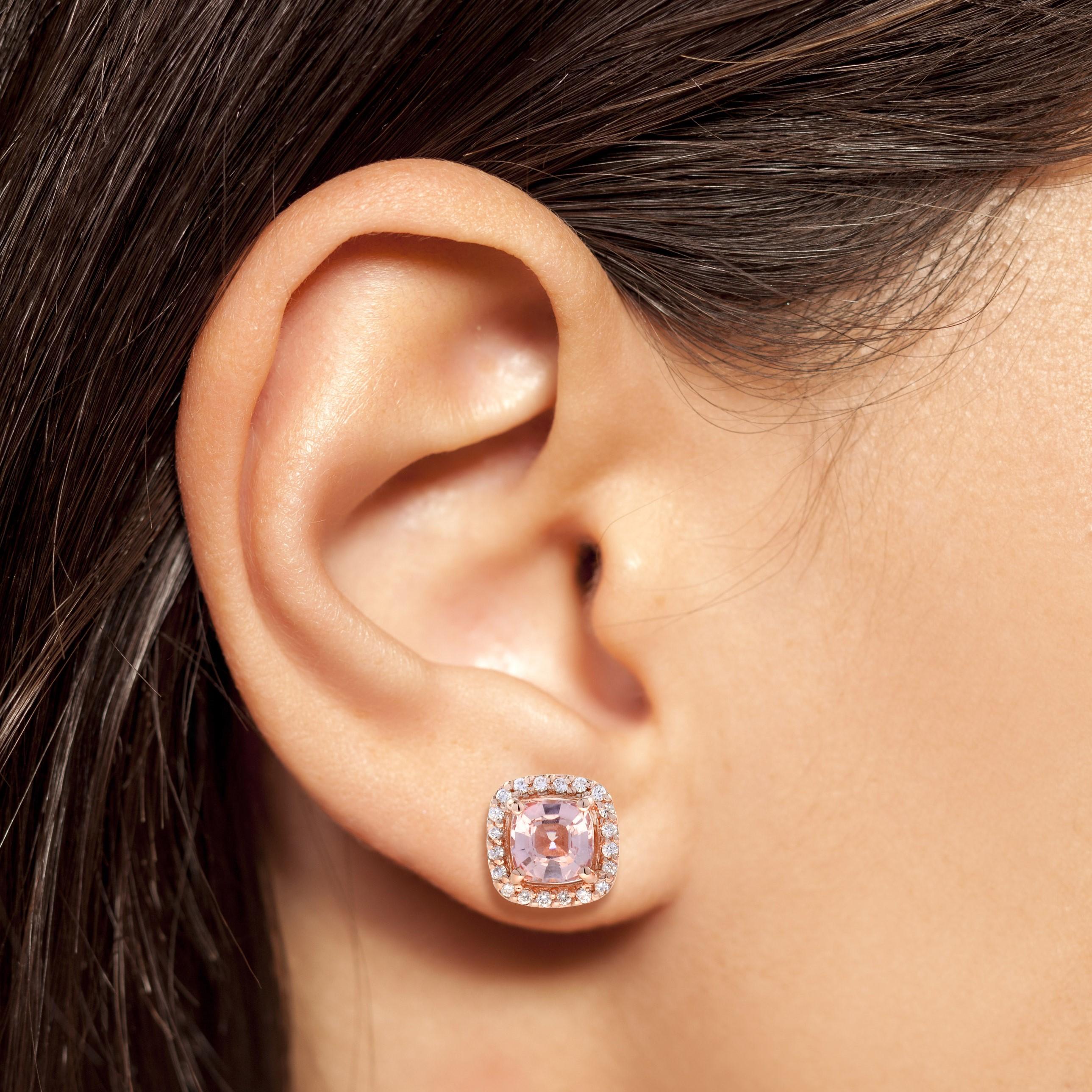 This gorgeous 14k rose gold halo earrings feature a 1.50 carat cushion-cut morganite (each)  surrounded by a halo of tiny diamonds. An effortless upgrade to your accessary wardrobe. Wear it with our same design ring and pendant for your perfect