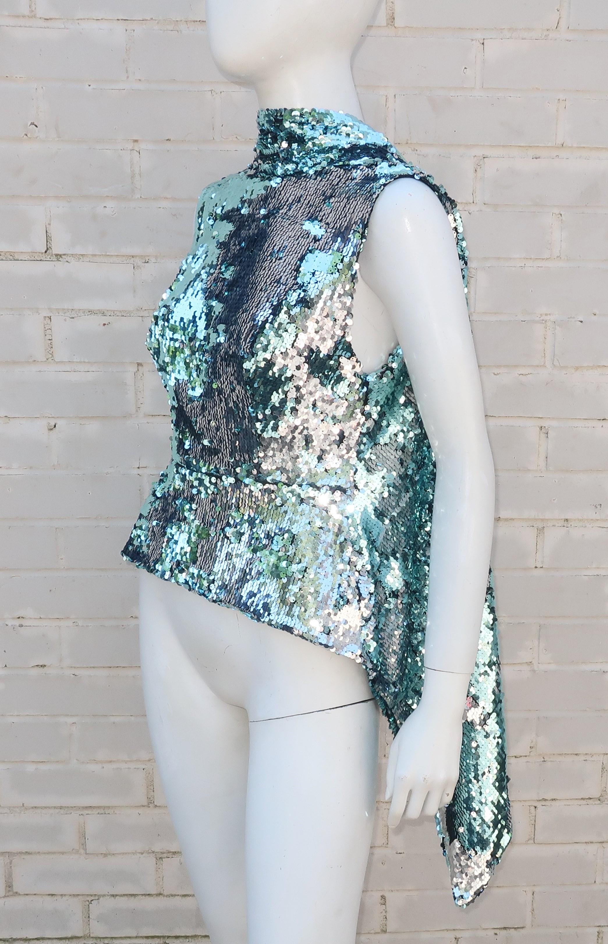 Inspired by disco days and Studio 54 looks, Michael Halpern's label creates glamorous garments including this dramatic sequin top.  The expertly cut silhouette effortless drops from the mock turtleneck to a built-in yoke with a drape down the back
