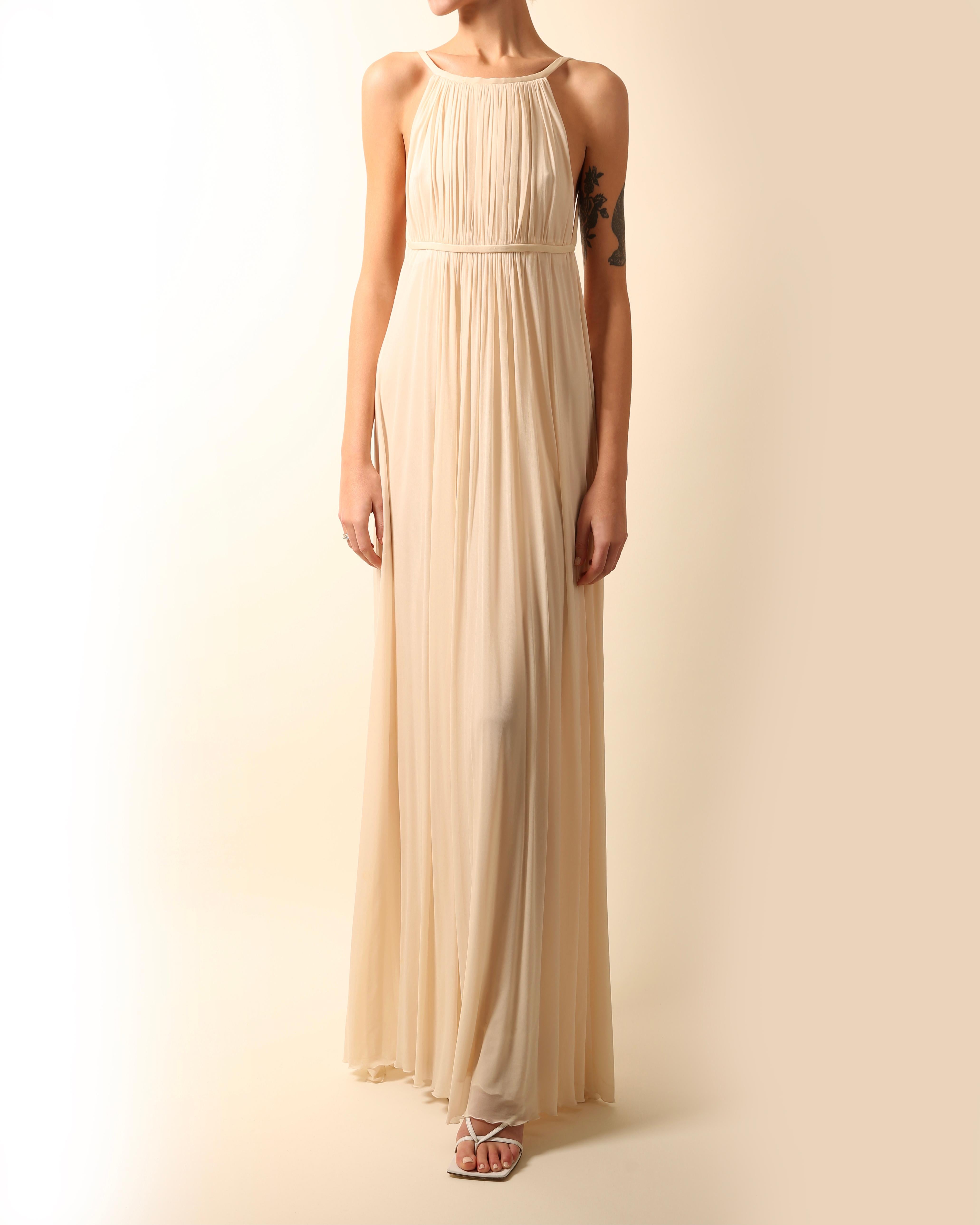 Halston 2009
Floor length grecian style plisse gown in cream
Completely backless cut

Composition:
100% Cupro

Size :
Marked as a size 42 - I believe this would be a FR 42 and not an IT 42. Due to the open bust and back this would work for a number