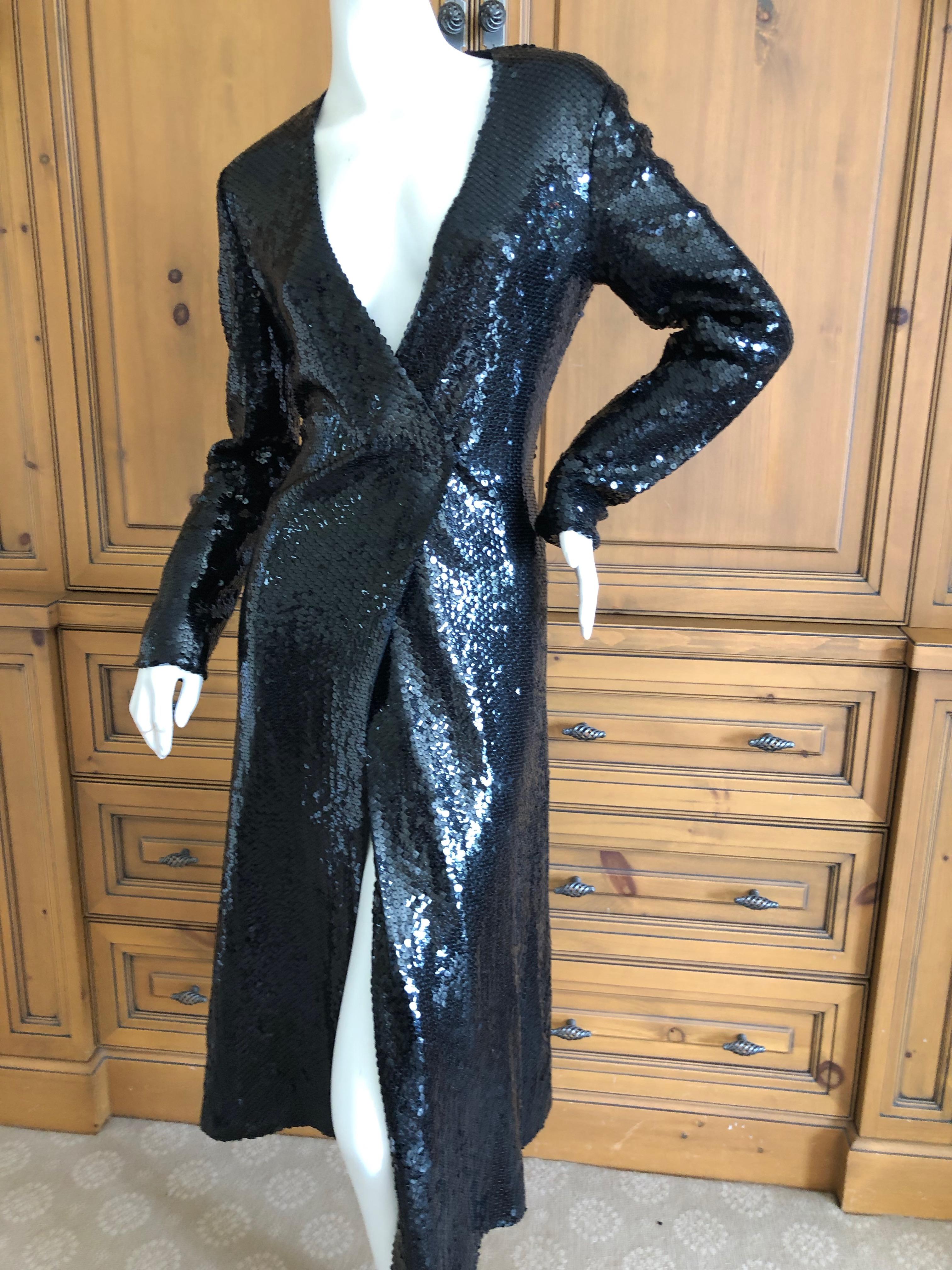 Halston 1970's Disco Era Low Cut Sequin Little Black Dress
This is so much prettier than the photos show, and needs to be seen in motion, preferably under the disco ball.
This is stunning, wrap style dress with snap closures.
Size L, no size
