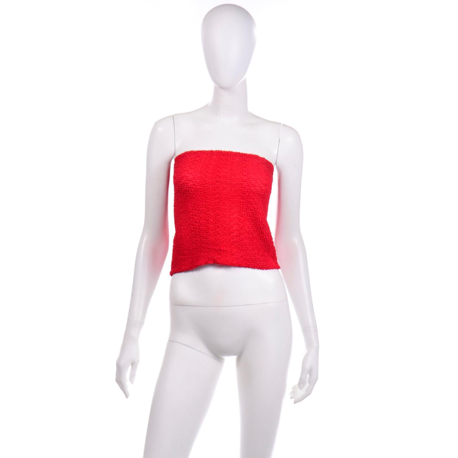 This is an iconic vintage Halston red puckered elastic tube top from the 1970's. This strapless top has really unique elastic veins along the inside of the fabric that creates a unique puckered effect on the reversed side. The top of the tube top