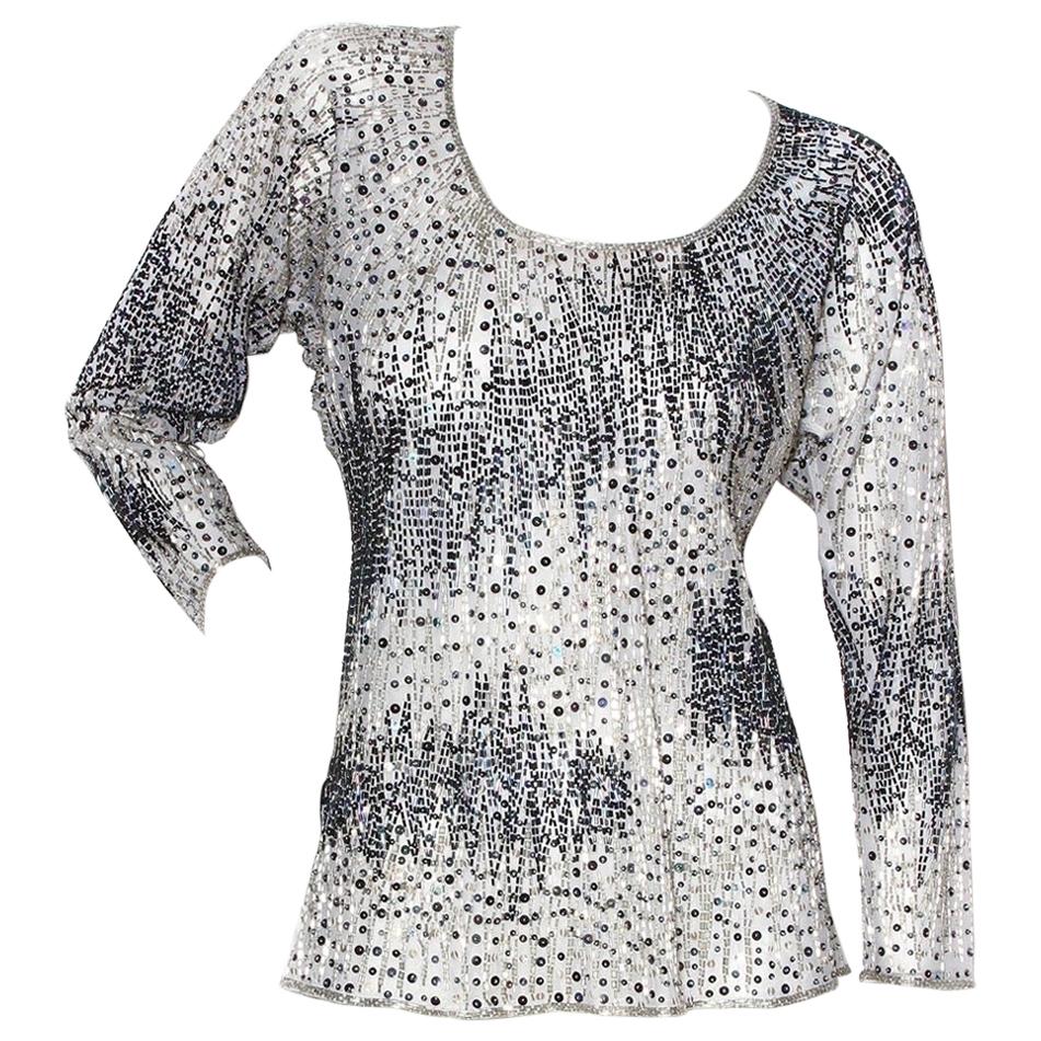 Vintage Beaded Top by Halston 
Circa 1970's
Silver, blue- iridescent 
Beaded throughout with zig-zag design  
Silver and navy iridescent beading 
Hand-embroidered
100% silk 
Made in India
Excellent vintage condition; consistent with age and use.