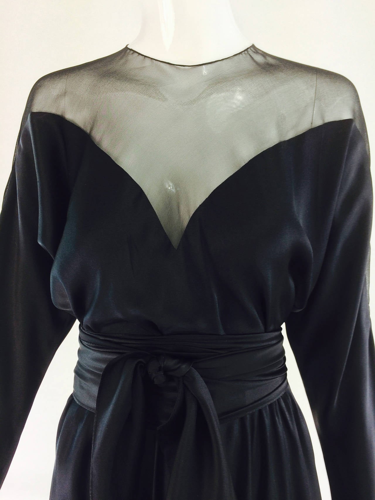 Halston black silk and chiffon silk bias cut cocktail dress cocktail dress from the 1970s. A similar dress was worn by Liza Minnelli in Halston's 1971 made to order show. I love the way this dress fits the body, skimming and clinging in all the
