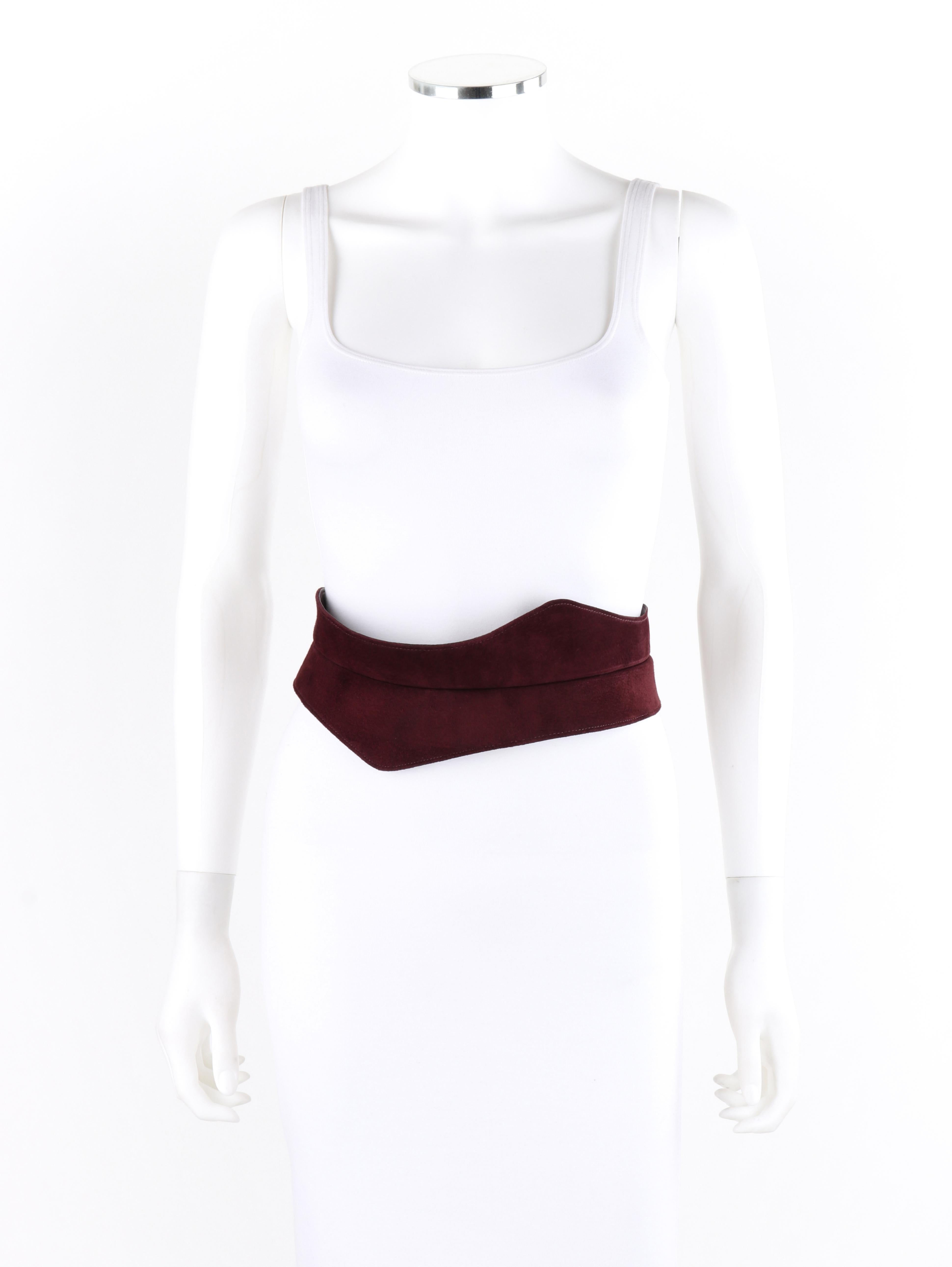 HALSTON c.1970's Burgundy Suede Leather Art Deco Avant Garde Tied Obi Waist Belt
 
Circa: 1970’s
Brand/Manufacturer: Halston
Designer: Roy Halston Frowick
Style: Obi belt
Color(s): Shades of red
Lined: Yes
Unmarked Fabric Content: Suede (exterior);