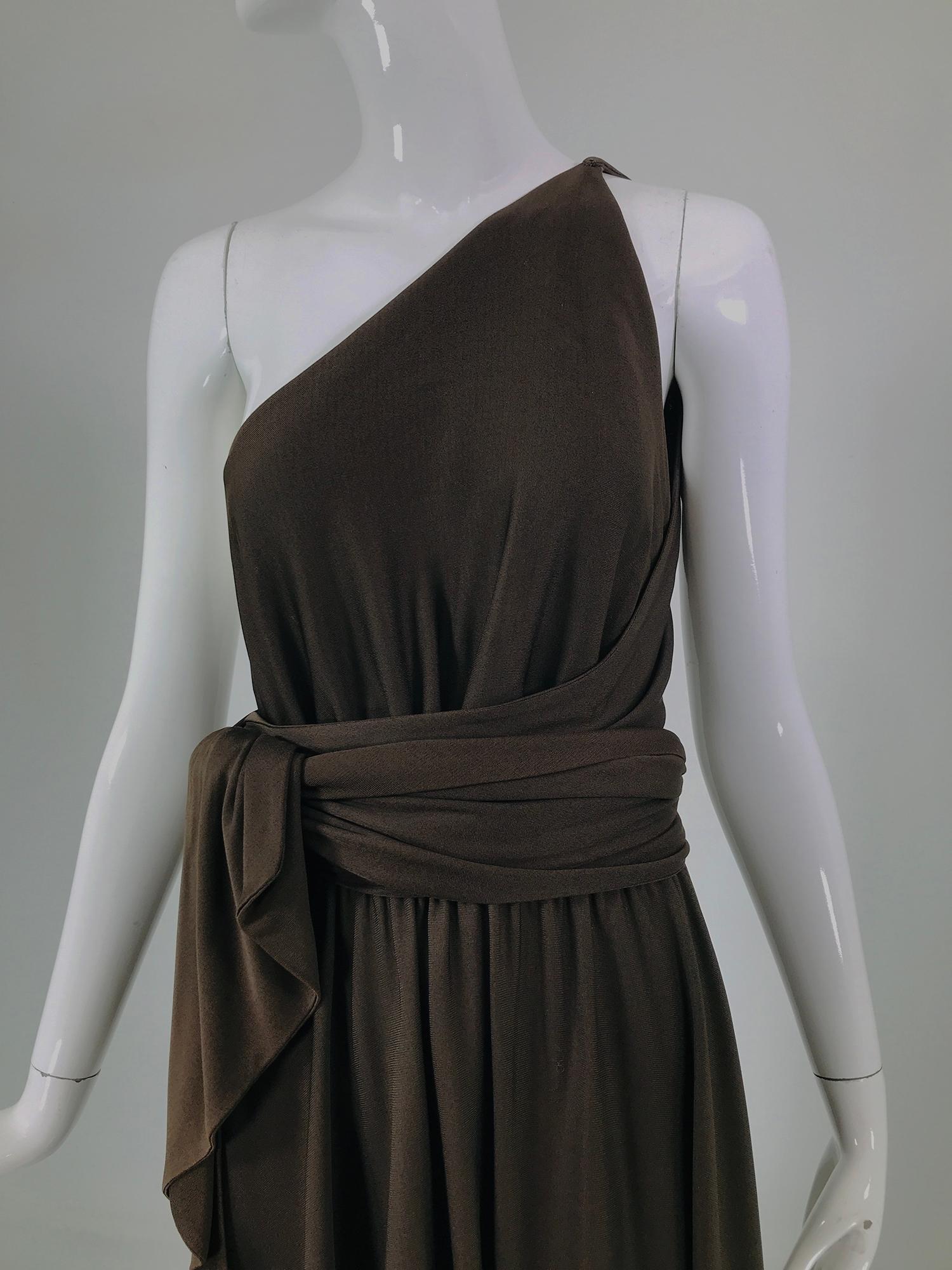 Halston chocolate brown silk double knit jersey, bias cut skirt & bodice, one shoulder wrap & tie top from the 1970s. Simple design, the dress has a cased elastic waist, with attached bias front & back panels that are joined at the left shoulder