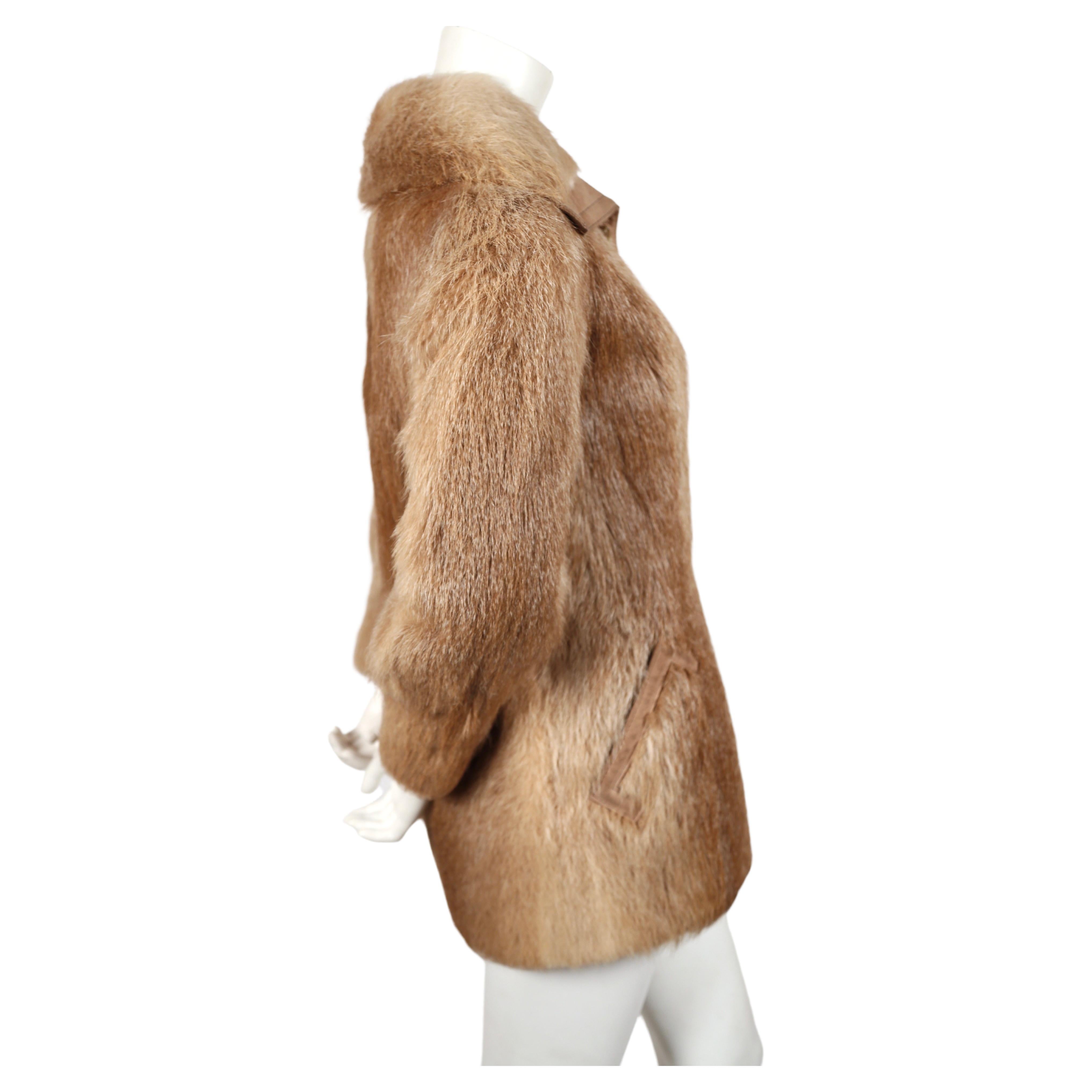 Nutria fur coat with large collar and suede trim from Halston dating to the late 1970's. Fits a size 4 or 6. Approximate measurements: 15