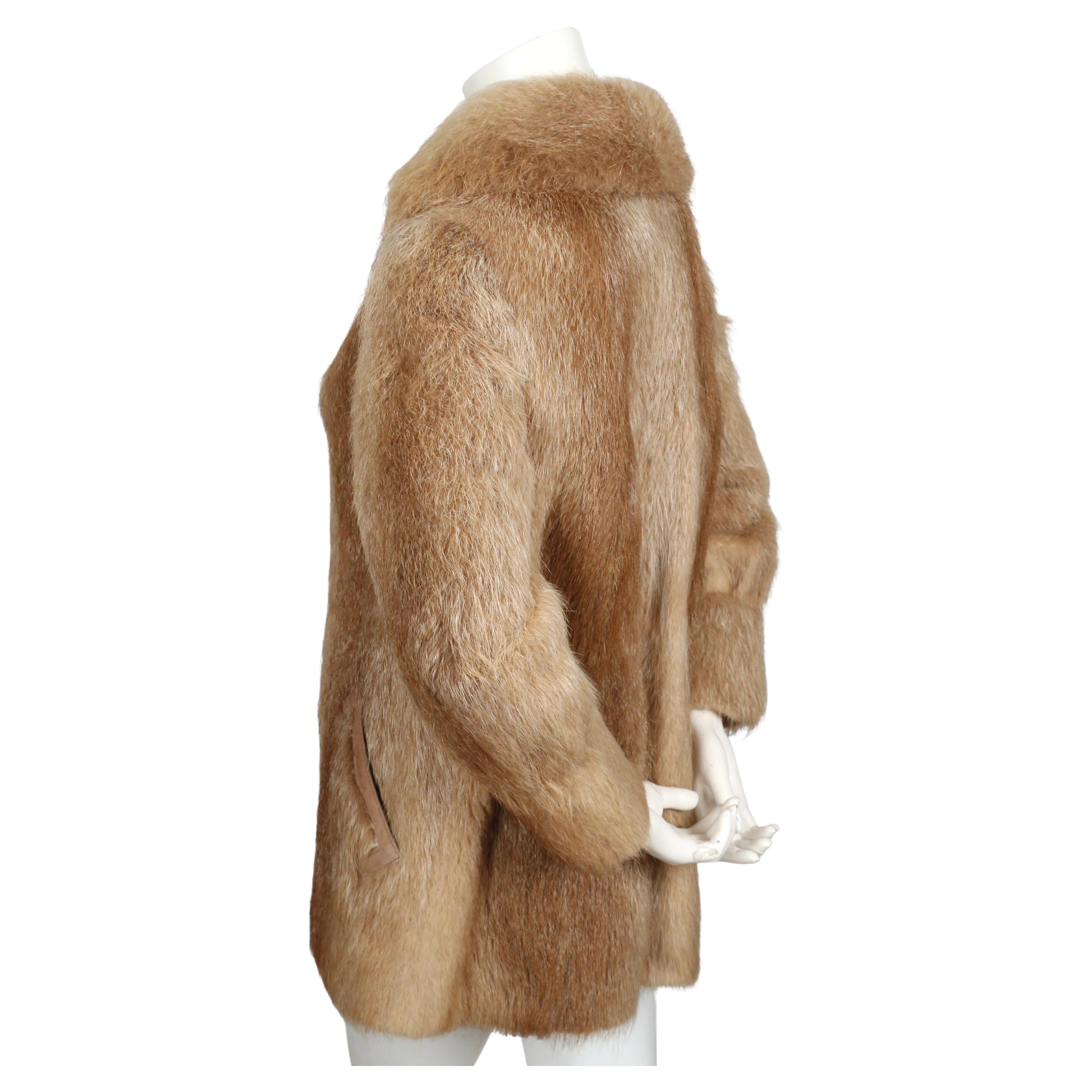 Nutria fur coat with large collar and suede trim from Halston dating to the late 1970's. Fits a size 4 or 6. Approximate measurements: 15