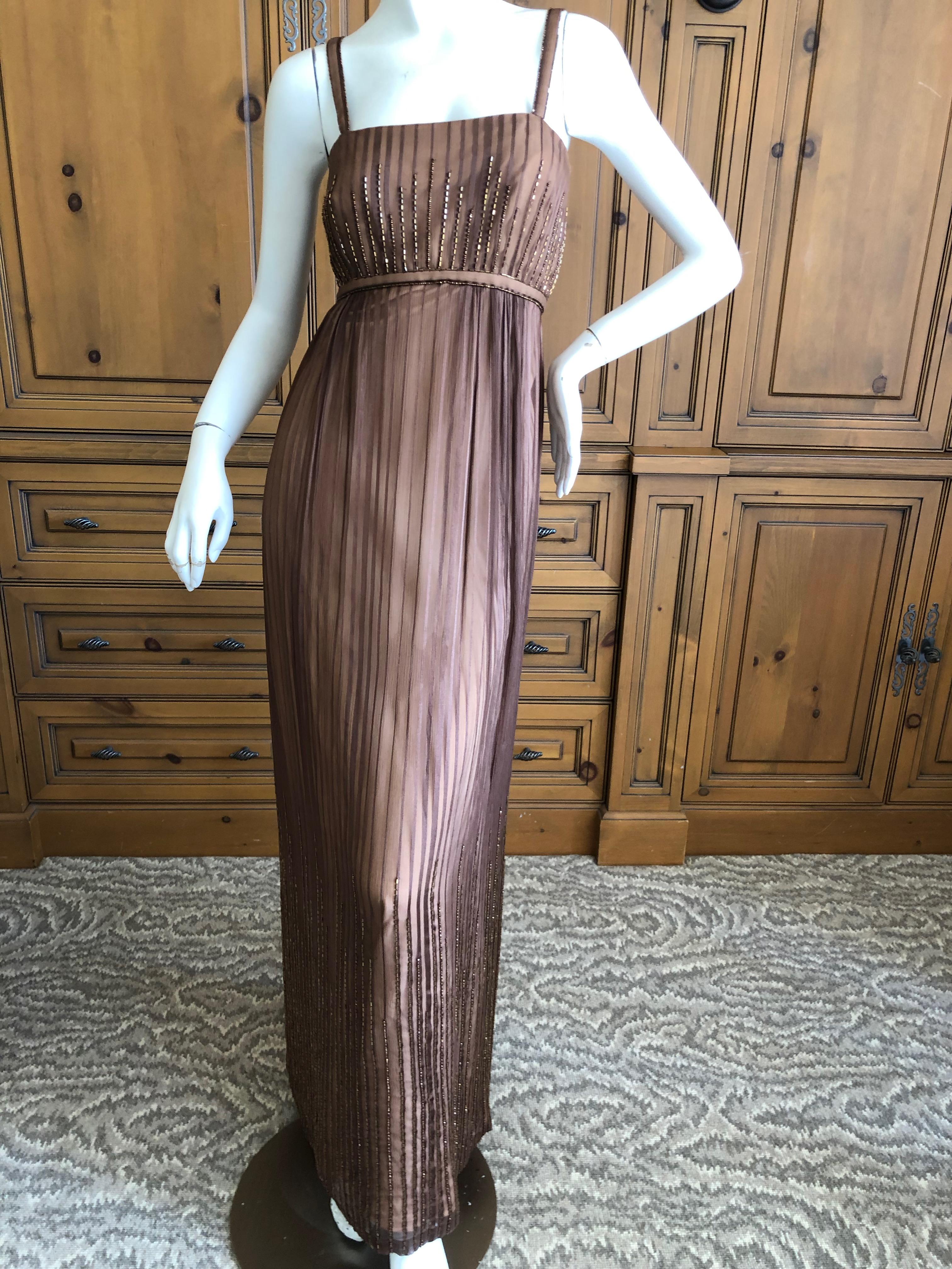 Halston for Martha Park Ave 1970's Beaded Chiffon Empire Dress with Collar Cape.
Bugle bead details o the dress match the bead trim on the collar , which has two long trailing scarves, so chic.
There is no size label
Bust 34