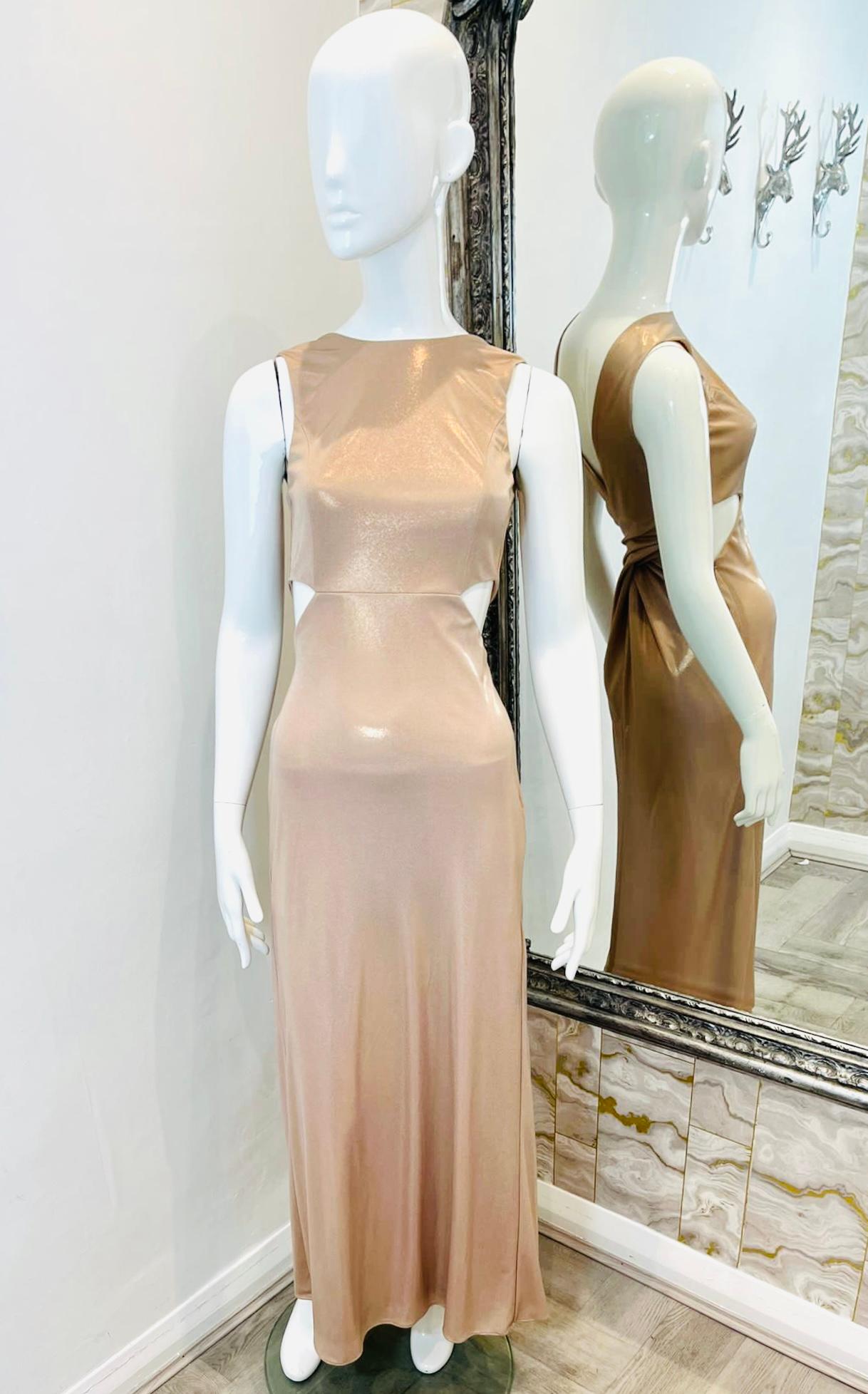 Halston Heritage Cut-Out Dress

Champagne gold, sparkling maxi dress designed with cut-out detailing to the sides.

Featuring deep V-Neck to rear and wrap-around accent.

Boat neckline, and pull-on, sleeveless style.

Size – XS

Condition – Very