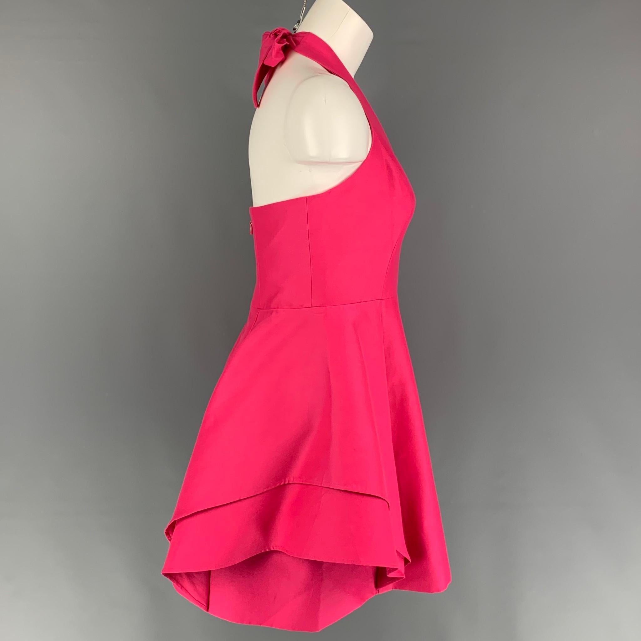 HALSTON HERITAGE dress comes in a pink cotton / silk featuring a pleated style, sleeveless, back zipper, and a top self-tie closure. 

Very Good Pre-Owned Condition.
Marked: 10
Original Retail Price: $450.00

Measurements:

Bust: 30 in.
Waist: 30