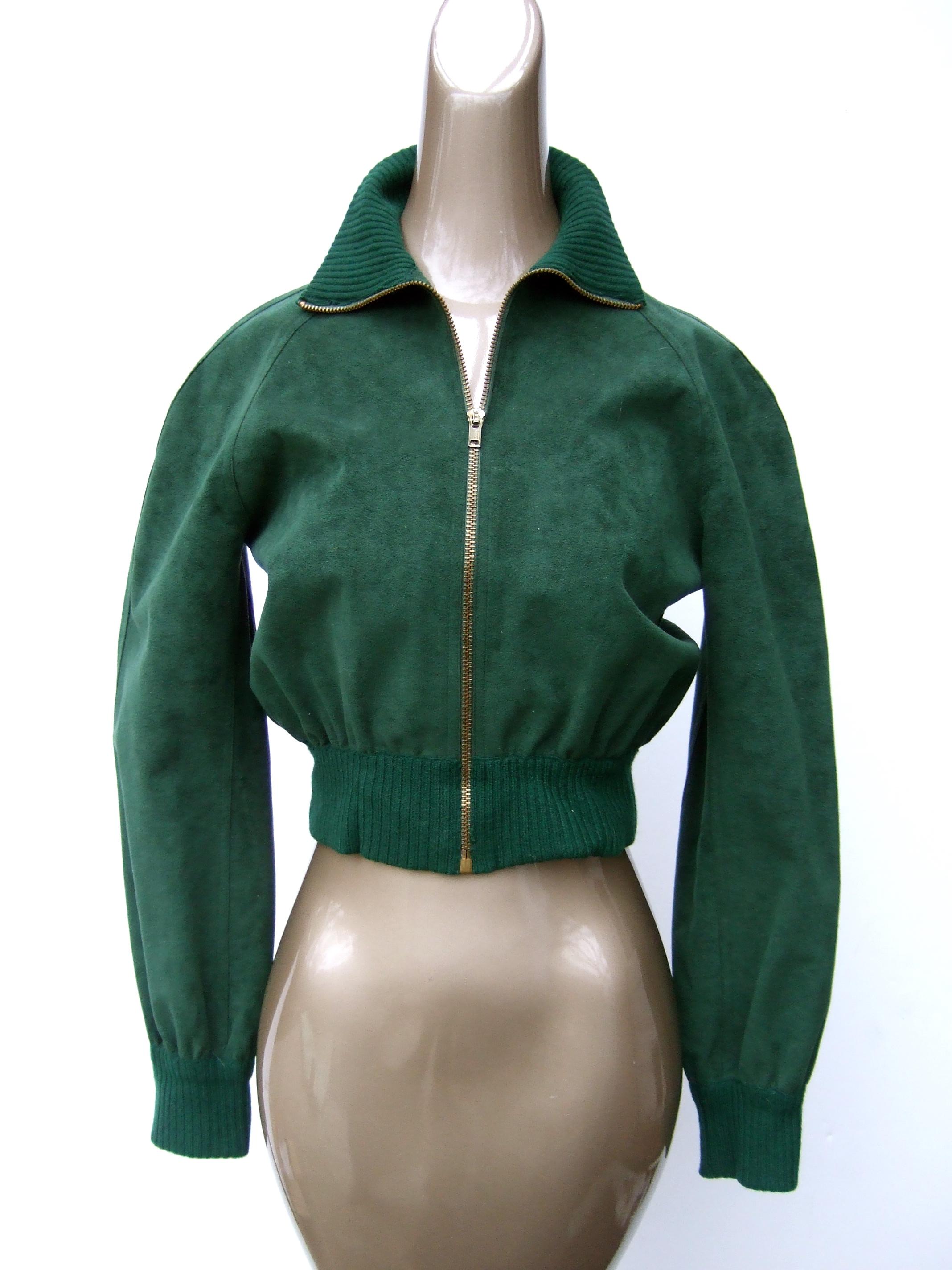 Halston Iconic ultra - feather faux suede bomber style zippered jacket c 1970s Petite Size
The stylish petite size cropped hunter green zippered jacket is constructed with Halston's
signature ultra - feather synthetic faux suede 

The cropped jacket