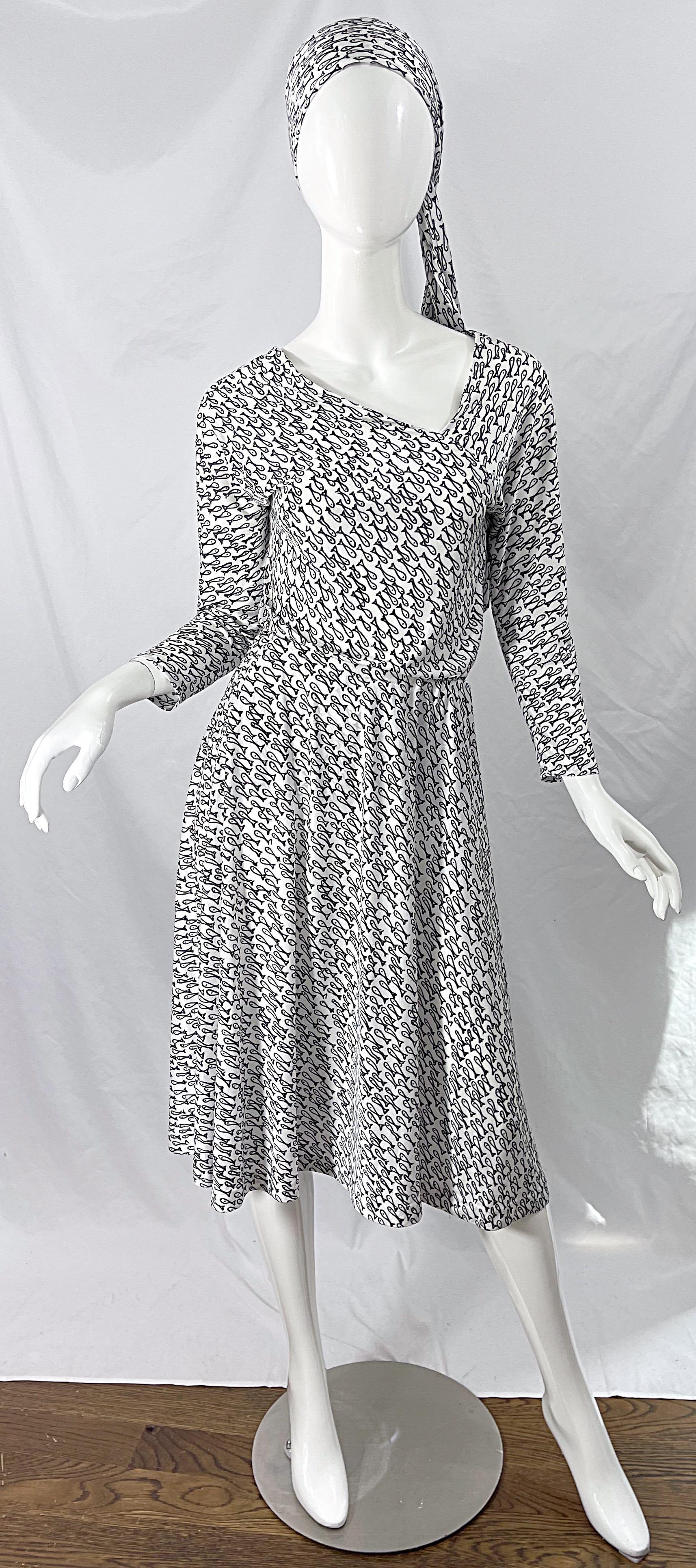 Rare HALSTON IV 1970s black and white novelty fish print three piece jersey ensemble ! Top features an asymmetrical neckline on the front and back. Skirt is a flirty easy fit with an elastic waistband. Sash can be used as a belt or head scarf. All 3