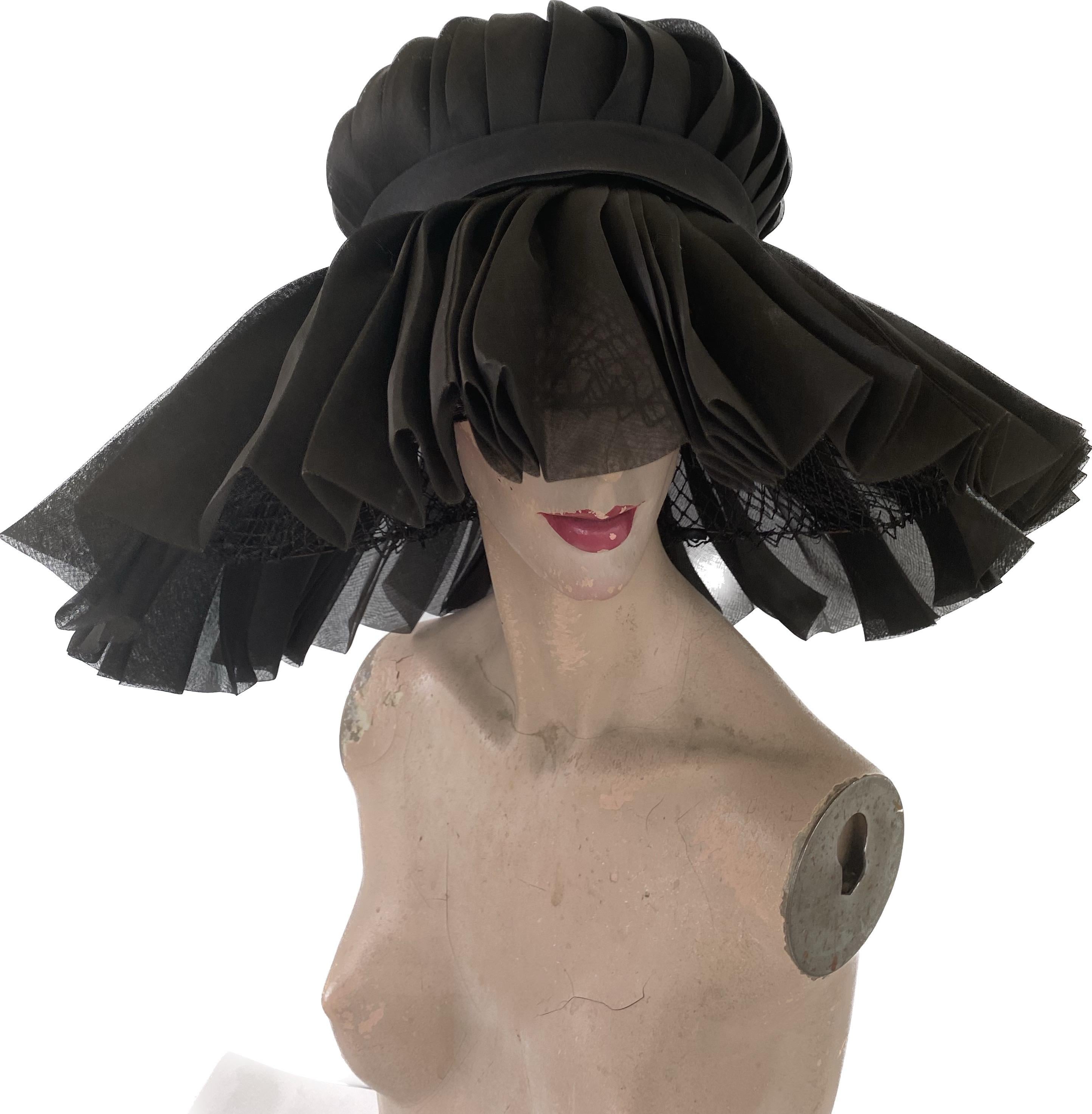 Rare and wonderful silk hat designed by Halston of Bergdorf Goodman 
Halston designed for Bergdorf Goodman in the 1960s 
This is a majestic piece , one of his earliest hats .
It is made of pleated silk with a swirled silk crown and a silk band and