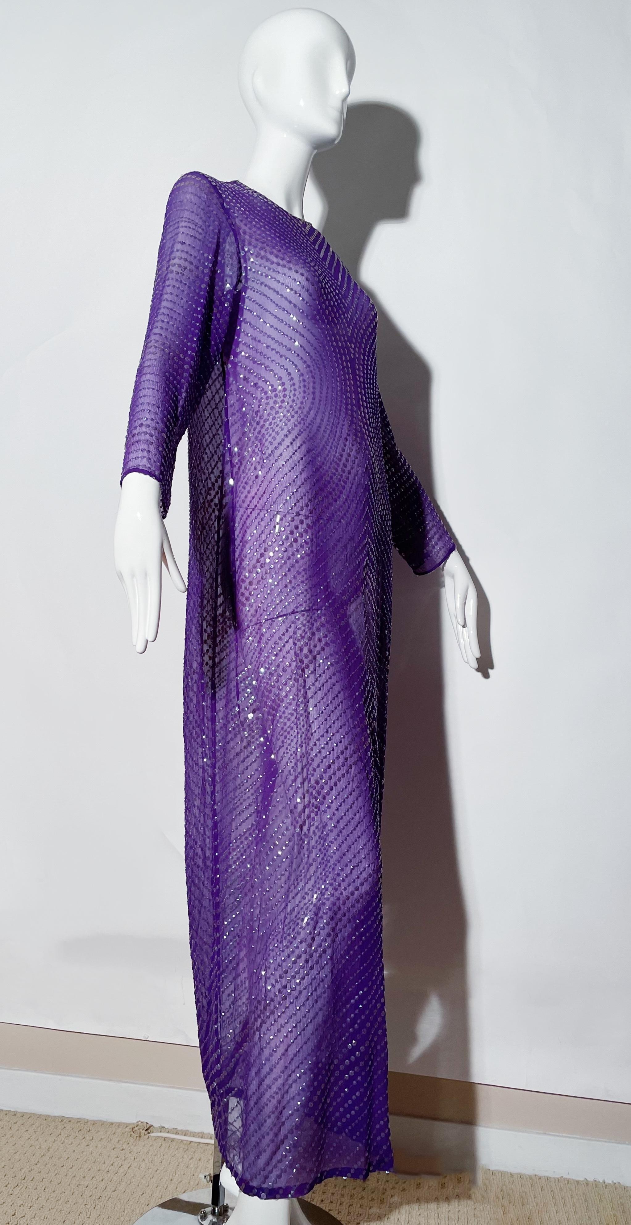 Sheer purple maxi gown. Longsleeve. Sequin detail. Rear snap closures. Silk. 
*Condition: excellent vintage condition. No visible flaws.

Measurements Taken Laying Flat (inches)—
Shoulder to Shoulder: 16 in.
Bust: 36 in.
Waist: 38 in.
Hip: 38