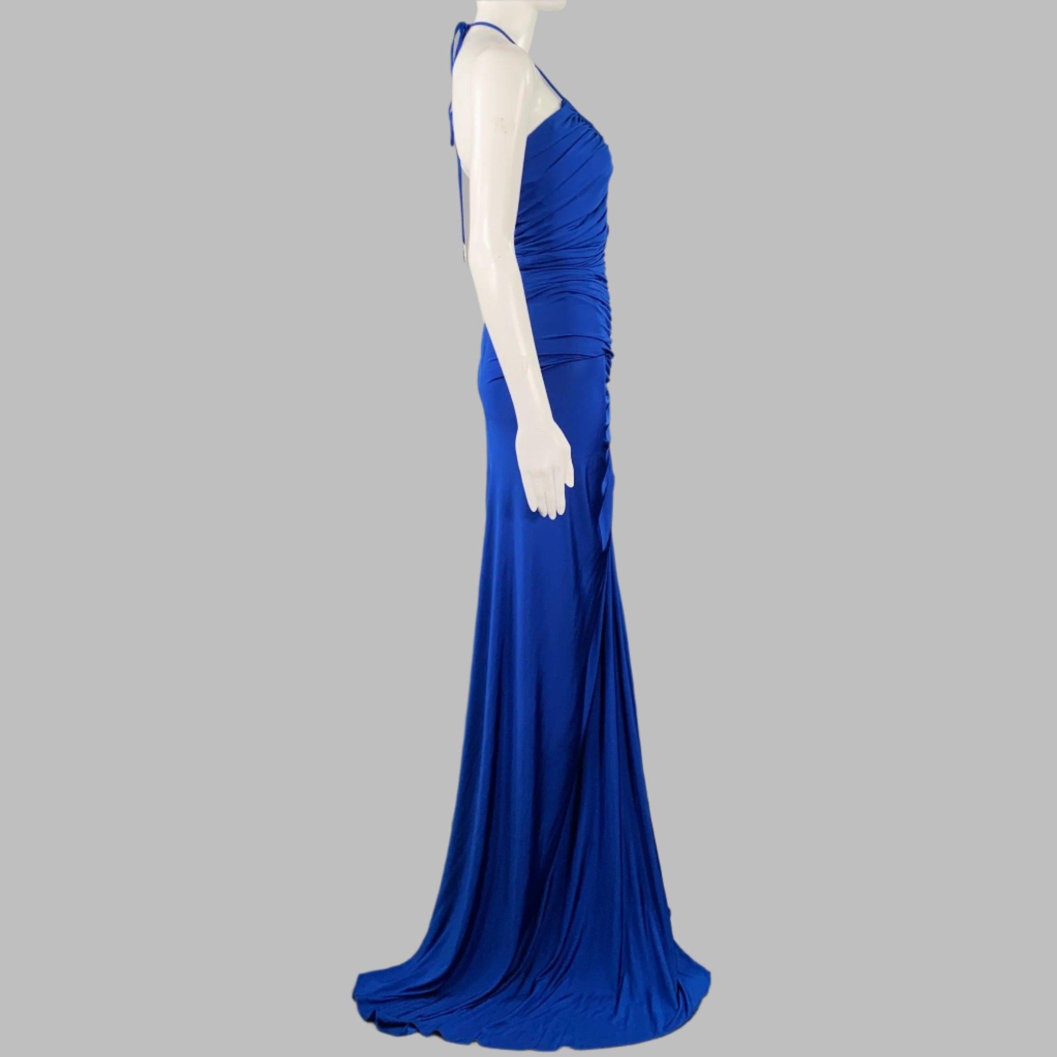 HALSTON gown
in a cobalt blue jersey featuring a form-fitting ruched style, floor length design, and halter top tie closure.New with Tags. 

Marked:   0 

Measurements: 
  
Bust: 38 inches Waist:
25 inches Hip:
33 inches Length: 57.5 inches 
  
  
