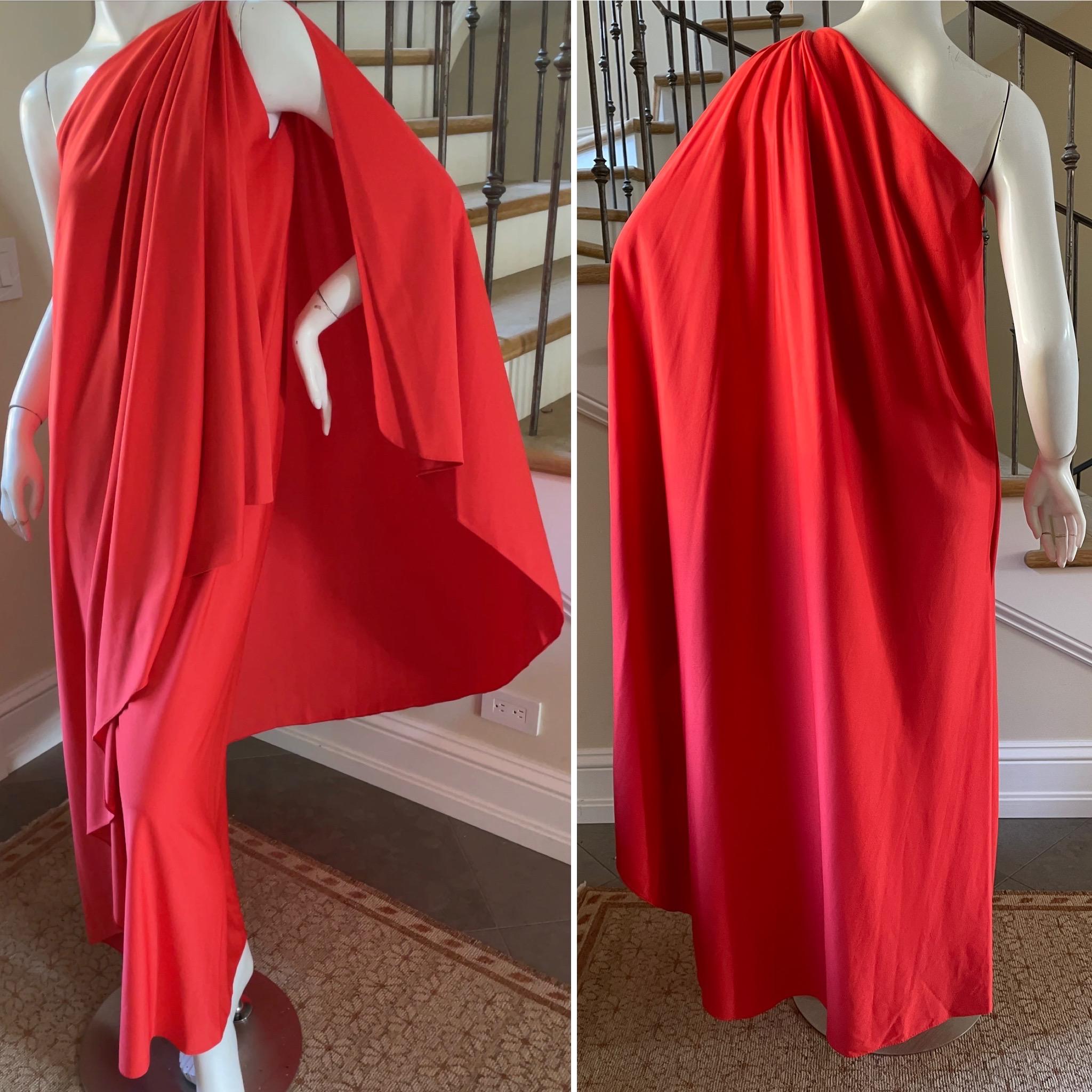 Halston Vintage 1980's Coral Red Caftan Dress.
The master of draping and gathering fabric, Halston elevated Caftan dressing in the 70's and 80's.
This beautiful piece was for his Halston IV line ,fashion for the masses. Chic, no?
Created with one