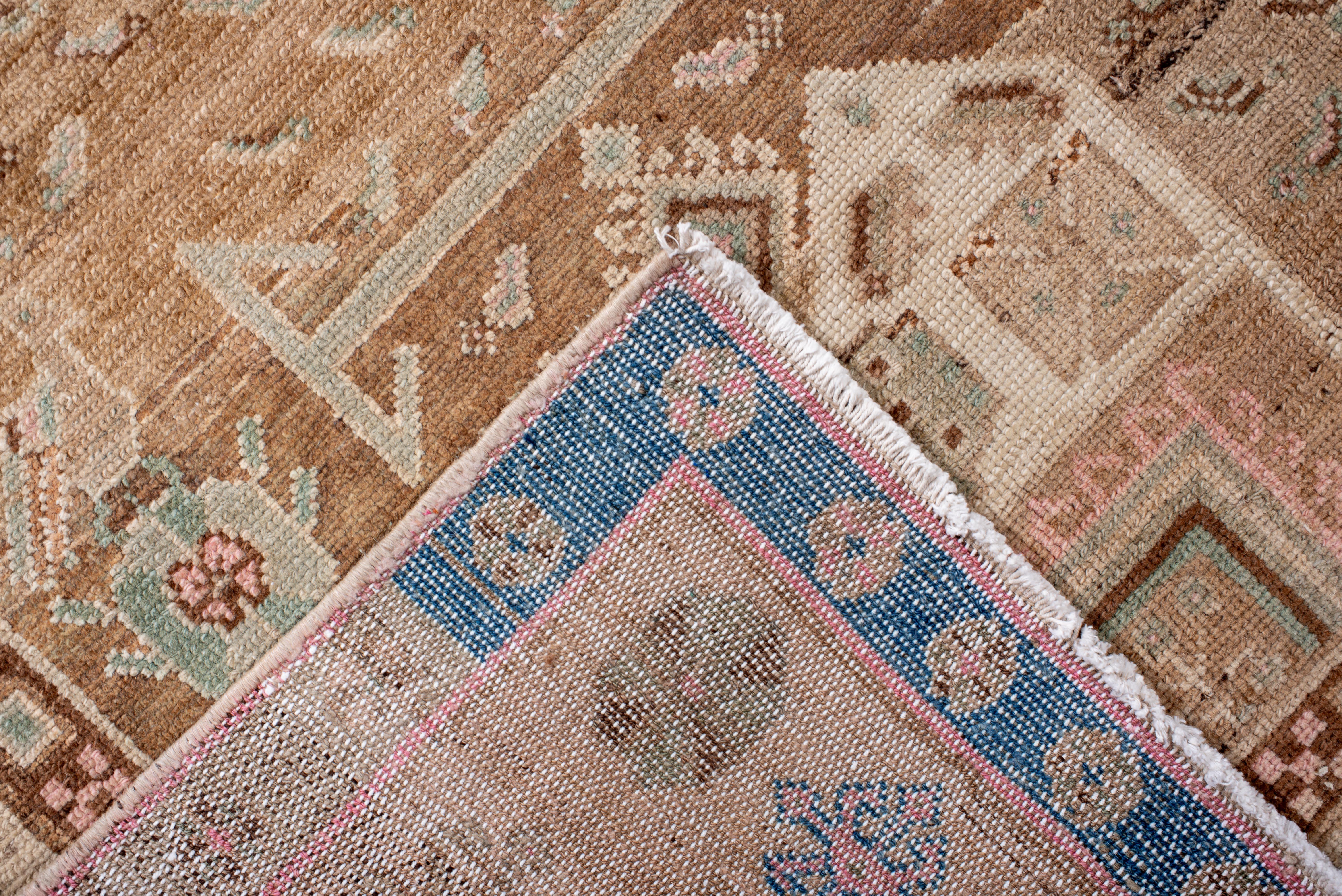 This vintage Hamadan rug presents a rare architectural medallion design rendered in a serene palette of warm sand, ivory, and muted blush, accented by soft sky blue and chocolate brown. The rug’s twin stepped medallions evoke the stylized form of