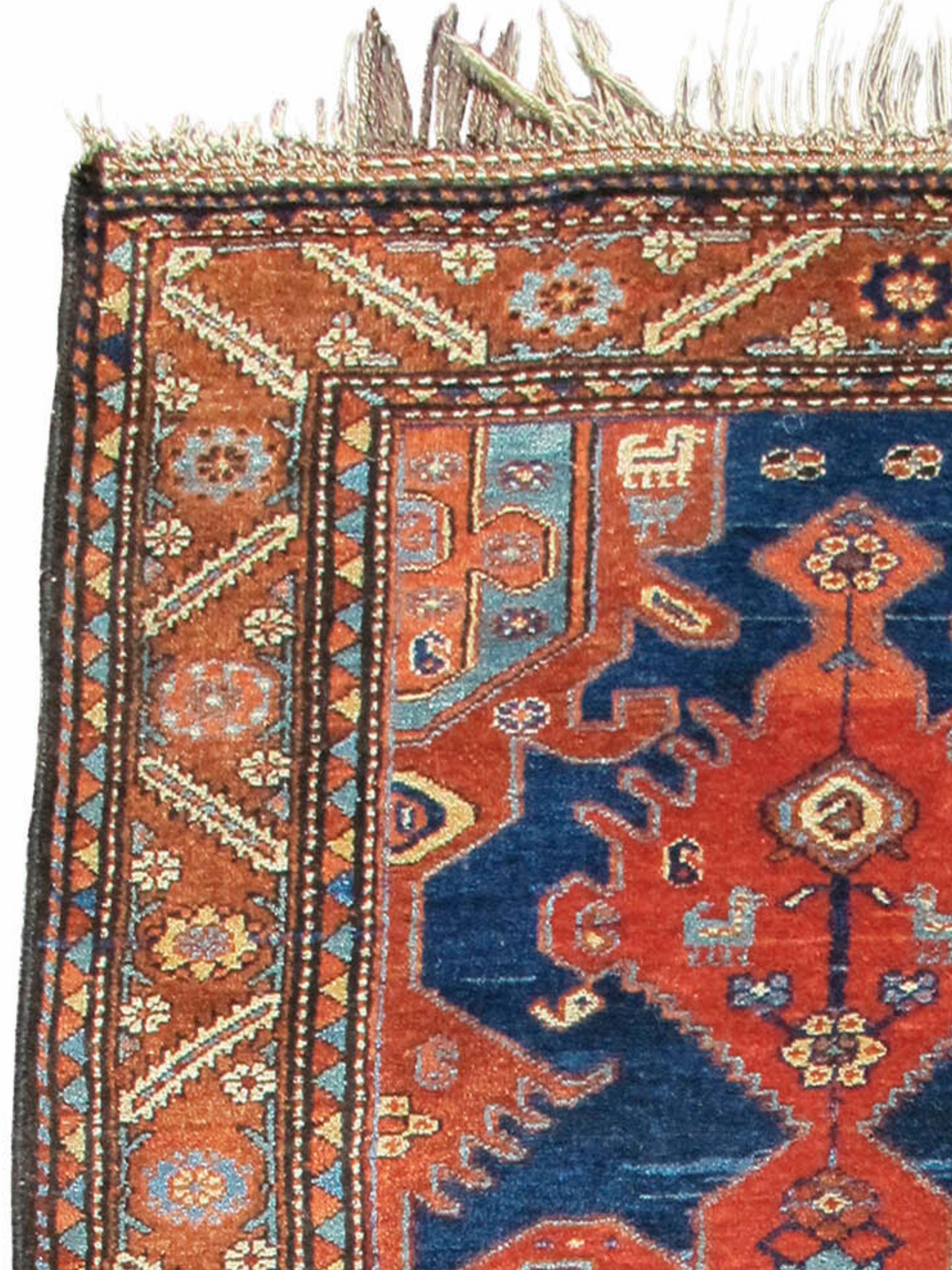 Hamadan Rug with Terracotta Medallion and Stylized Animal Motifs, Early 20th Century

This happy Hamadan rug draws an abstracted, fully contoured terracotta medallion against a complementary, contrasting modulated blue indigo field. The piece is