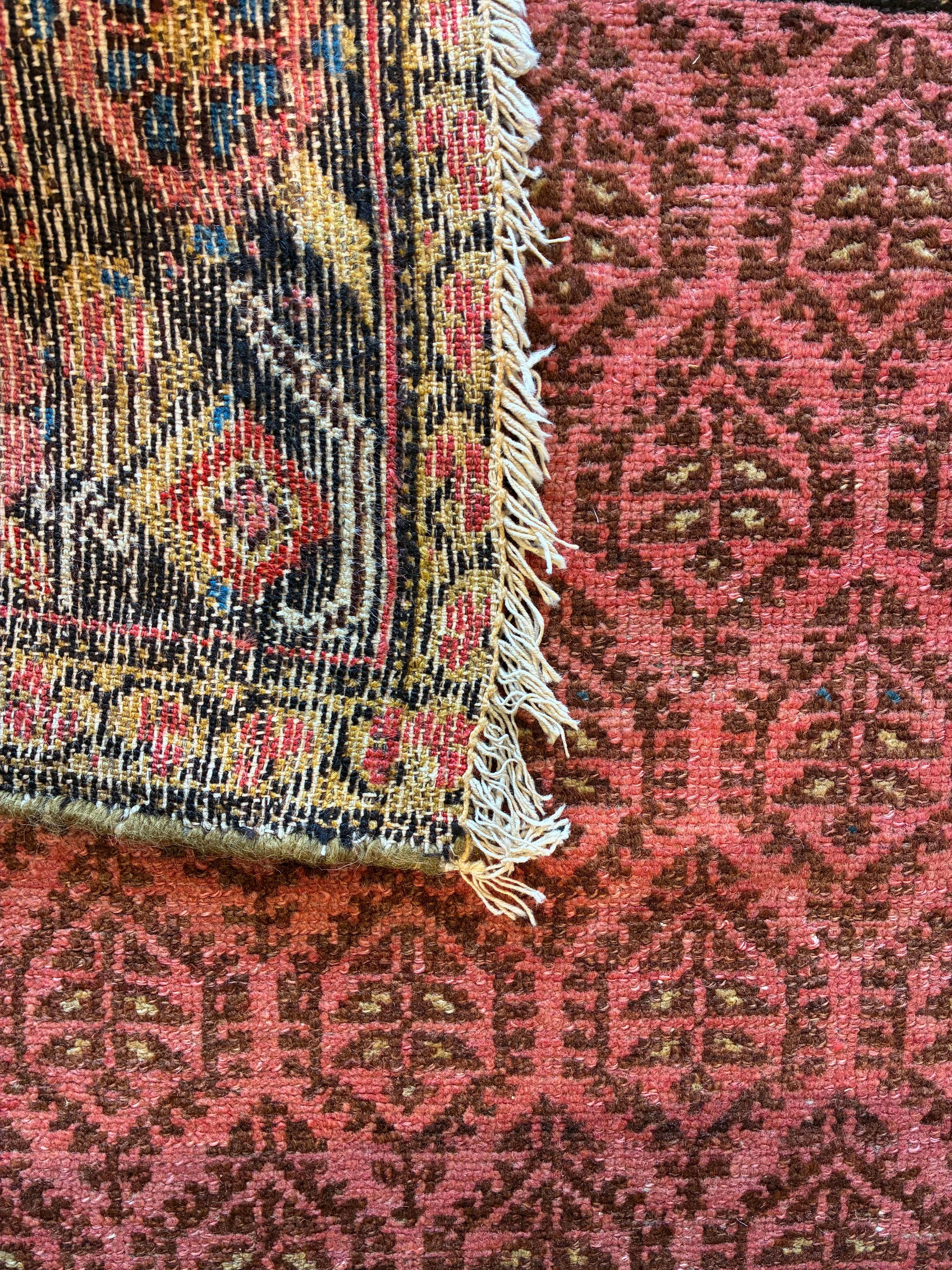 Antique Hamadan Runner, c. 1900

This charming Hamadan runner renders a formal central medallion layout using a more rustic village aesthetic. The colorful floral border is a variant of the ‘minakhani’ design more popular in neighboring Kurdistan to