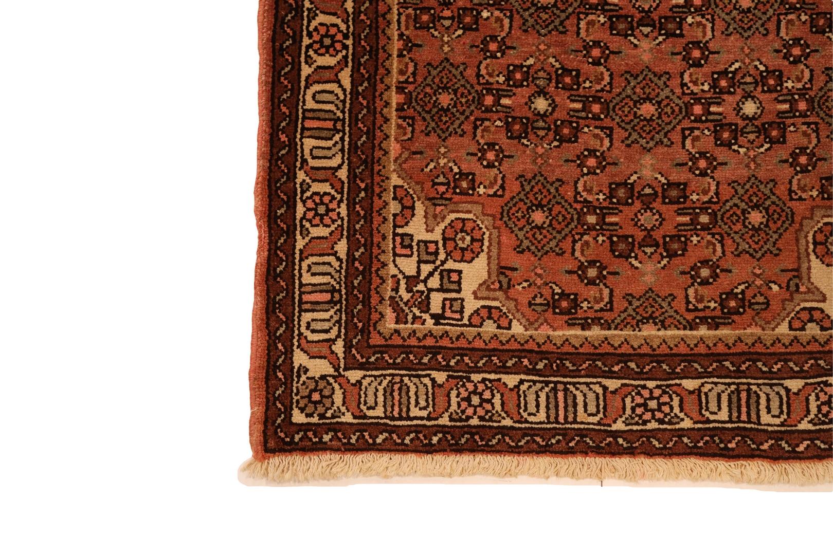 Introducing the Hamedan Runner, a captivating masterpiece that weaves together tradition and timeless elegance. This runner boasts a rich red background, setting the stage for a stunning display of intricate motifs and vibrant colors. At its heart
