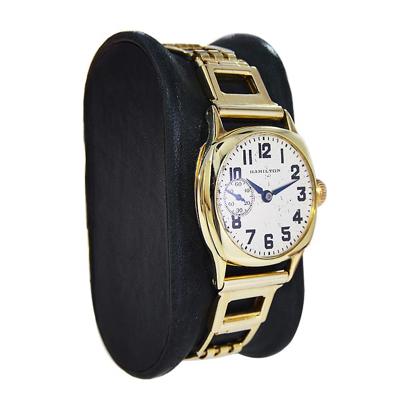 FACTORY / HOUSE: Hamilton Watch Company
STYLE / REFERENCE: Cushion Shape
METAL / MATERIAL: 14Kt Solid Yellow Gold
CIRCA / YEAR: 1925
DIMENSIONS / SIZE: Length 27mm X Width 35mm
MOVEMENT / CALIBER: Manual Winding / 17 Jewels / Caliber 986A
DIAL /